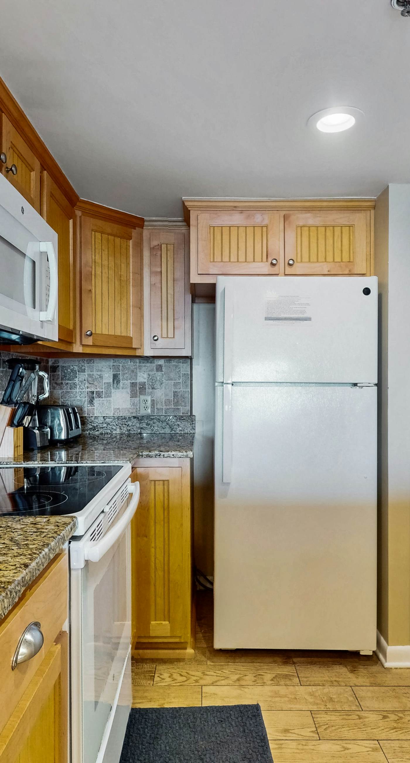 Waterfront condo w/ an open dining & living area, private balcony, shared pools