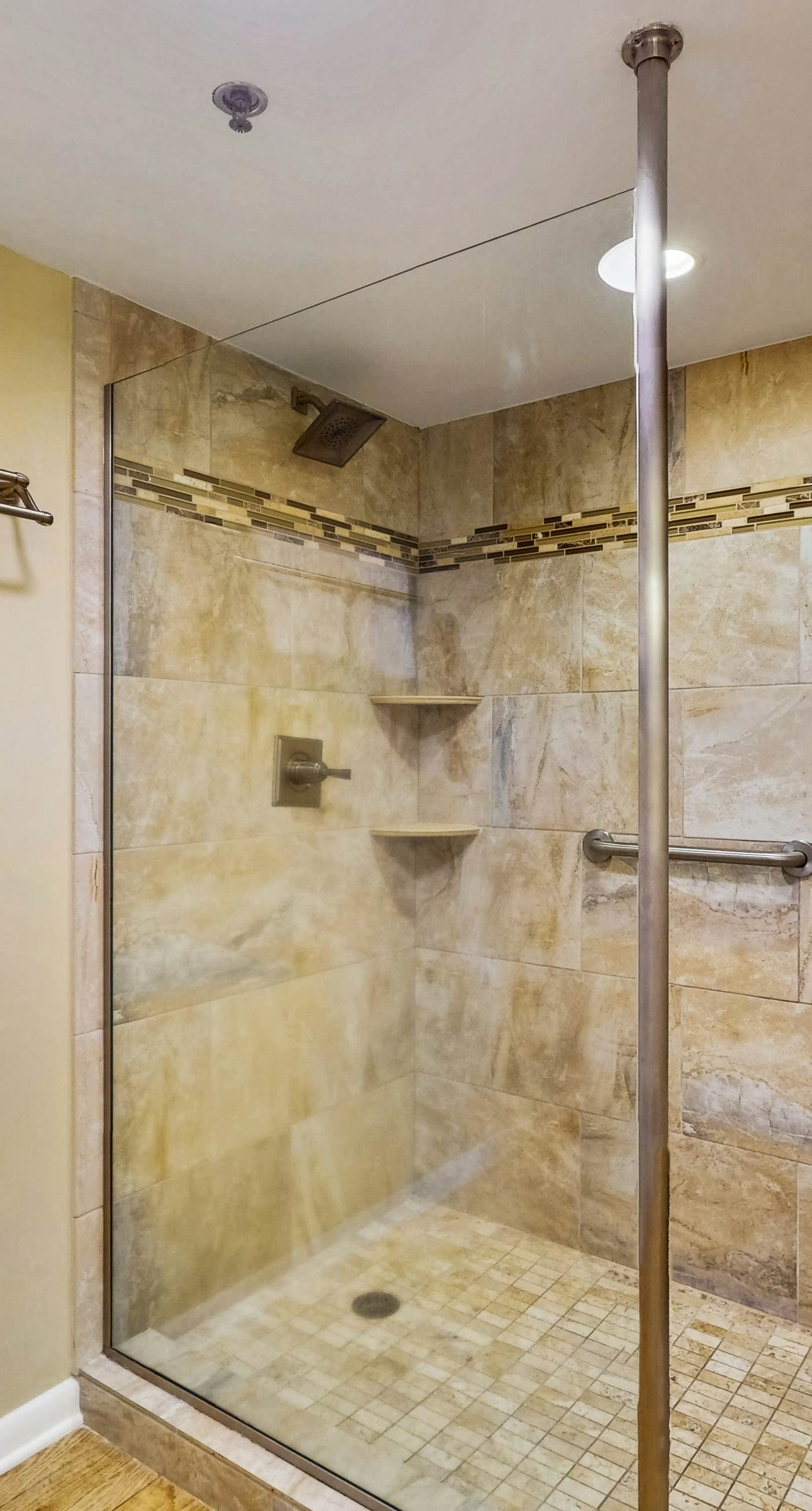 Waterfront condo w/ an open dining & living area, private balcony, shared pools