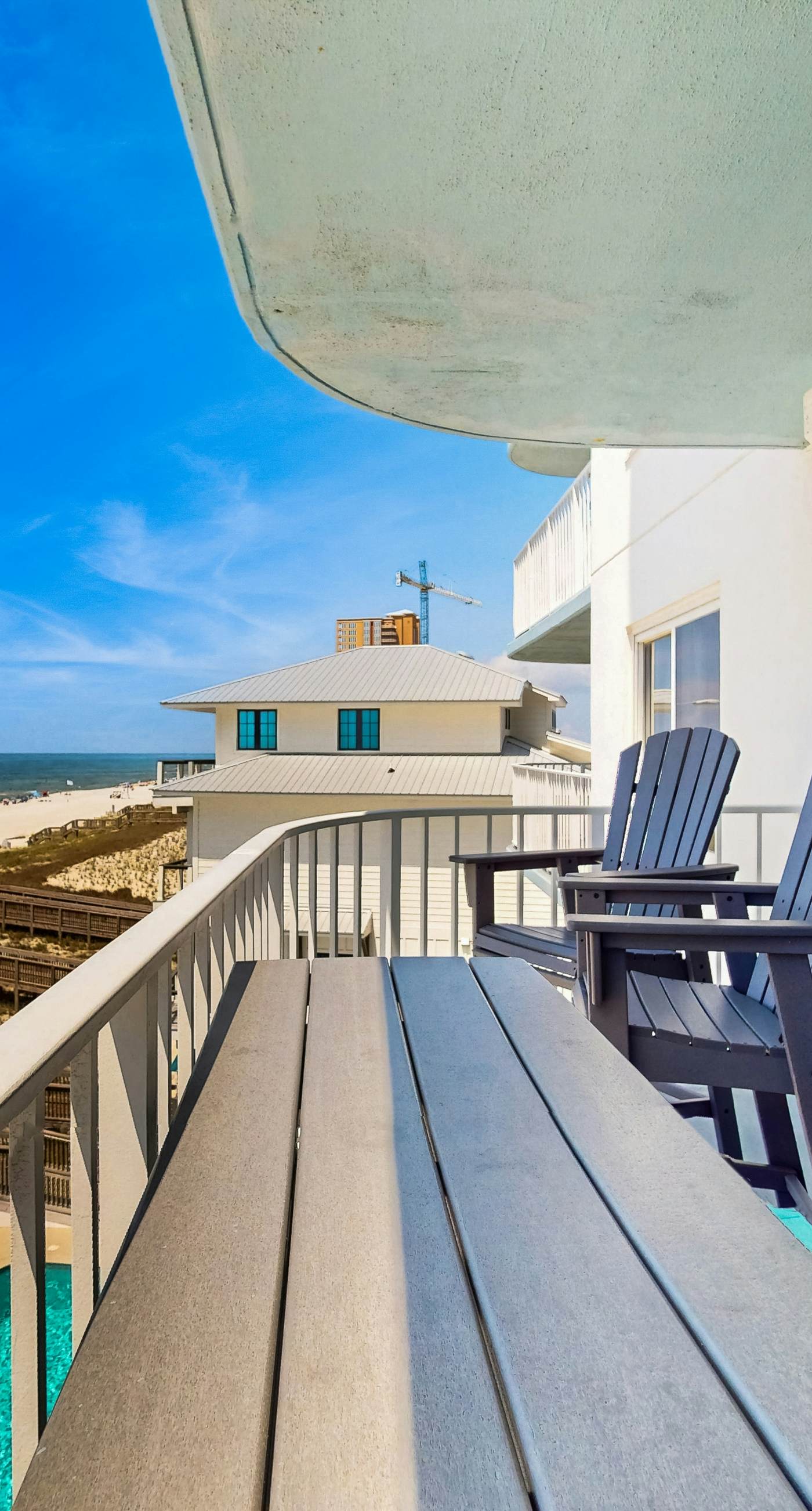 Waterfront condo w/ an open dining & living area, private balcony, shared pools