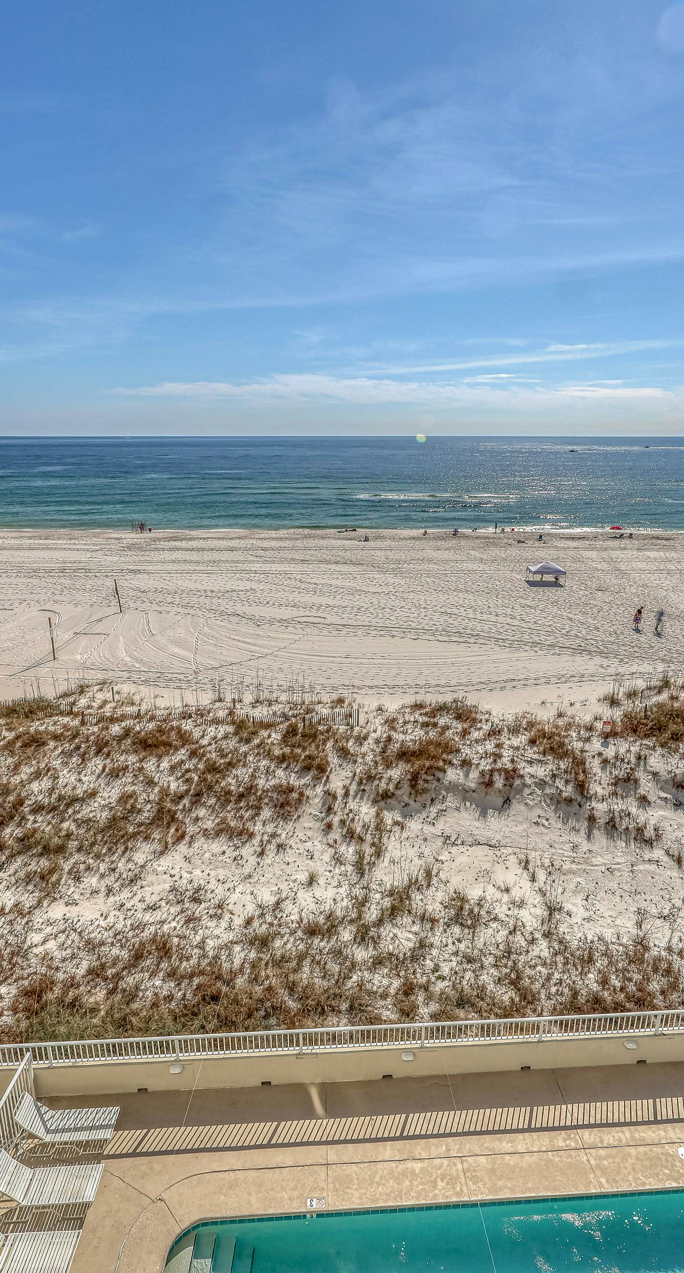 Waterfront condo w/ an open dining & living area, private balcony, shared pools