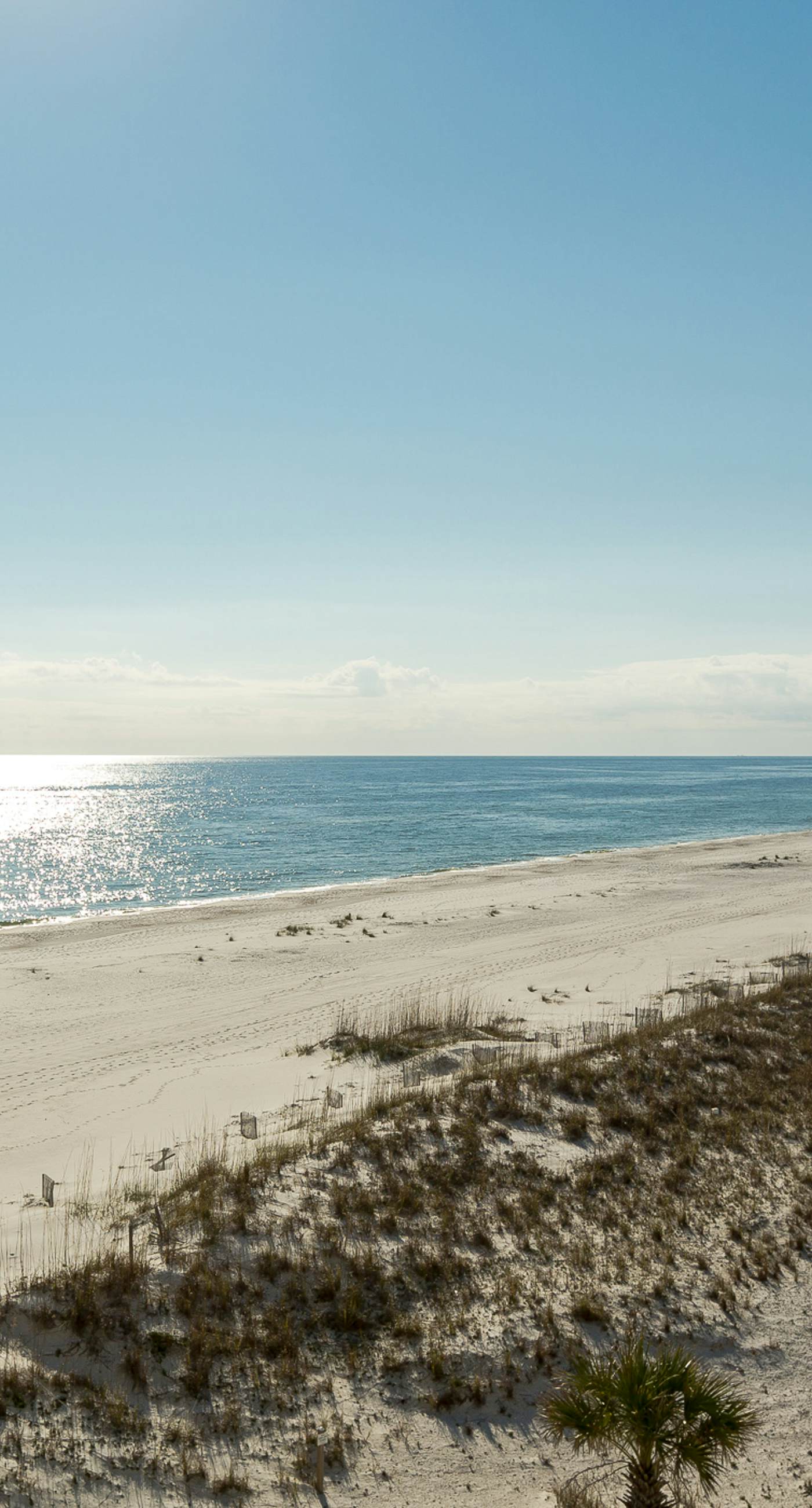 Waterfront condo w/ an open dining & living area, private balcony, shared pools