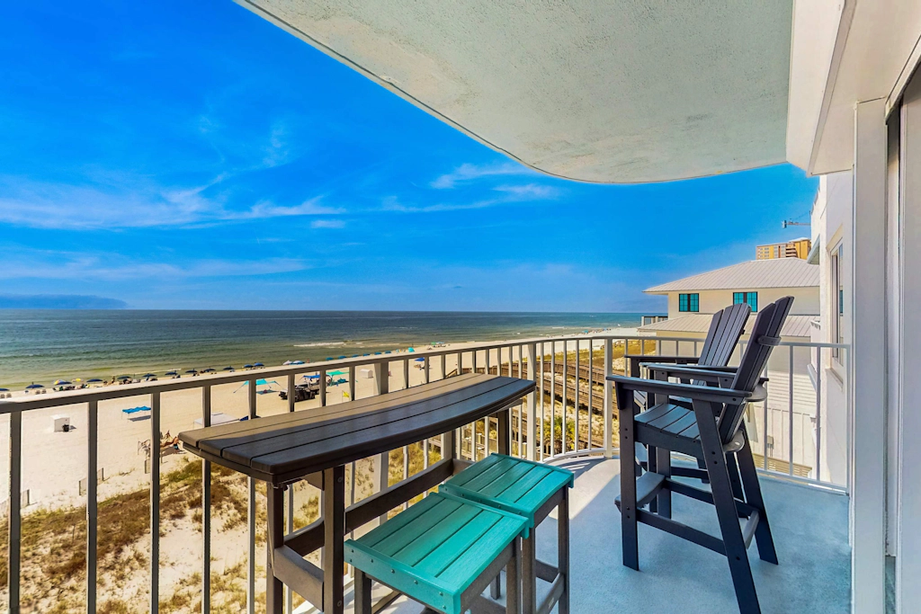 Waterfront condo with an open dining & living area, private balcony, shared pools