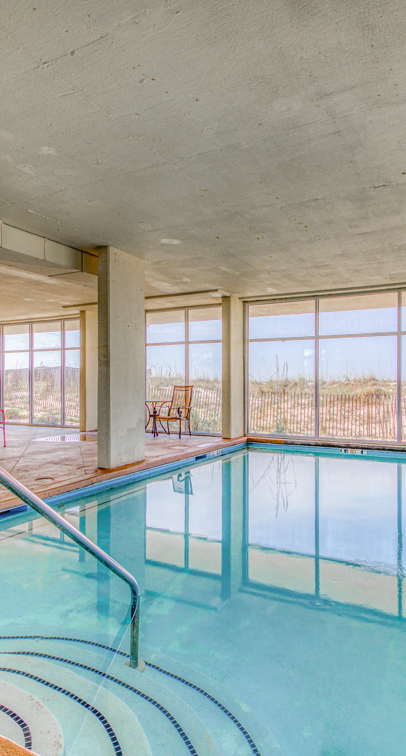 Fourth-floor beach condo w amazing views, indoor pool, & beach access