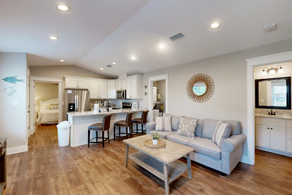 Inviting home near the beach with balcony, full kitchen, central AC, & W/D