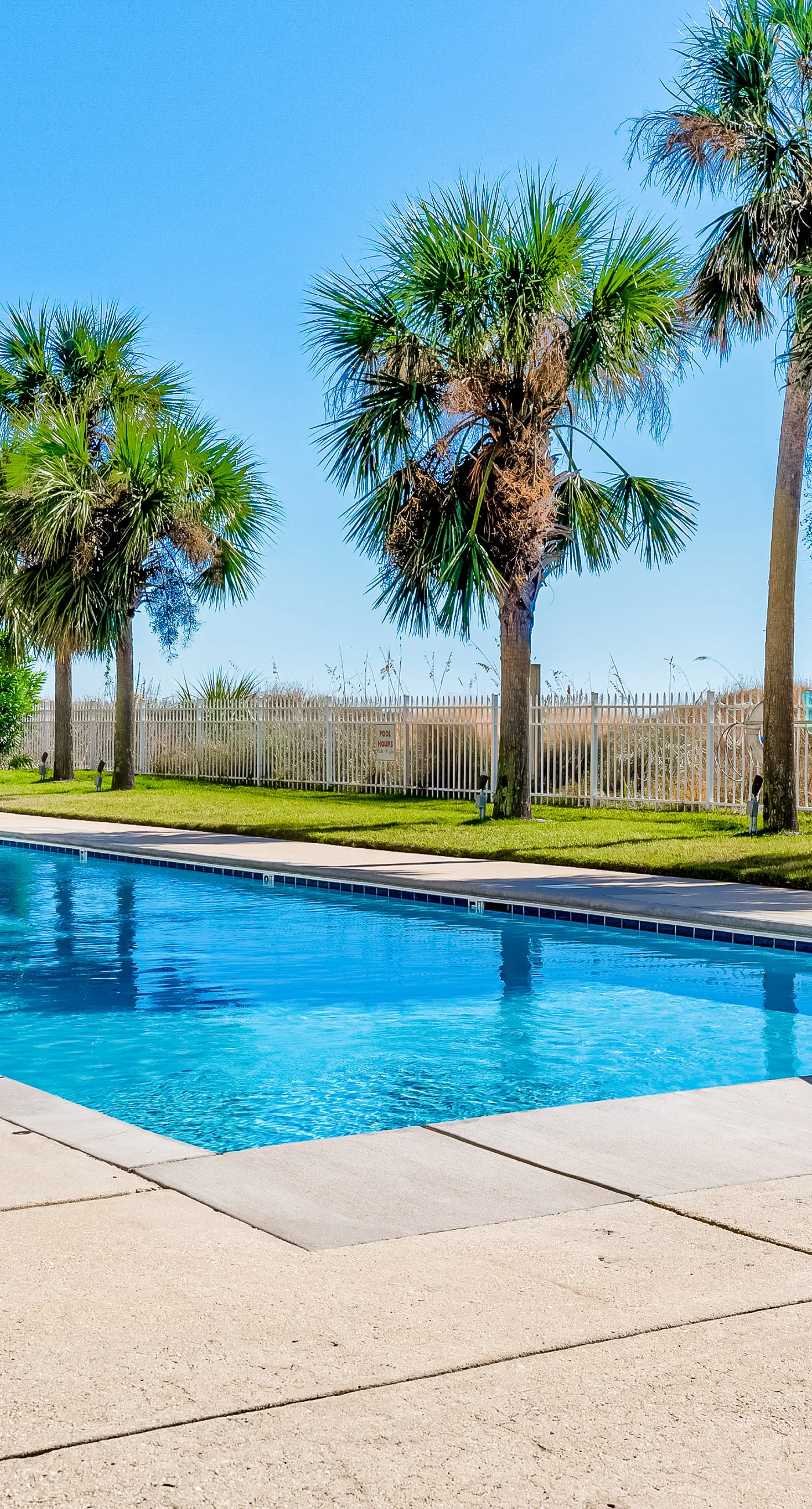 Ground-floor condo next to on-site pool with private patio & beach access