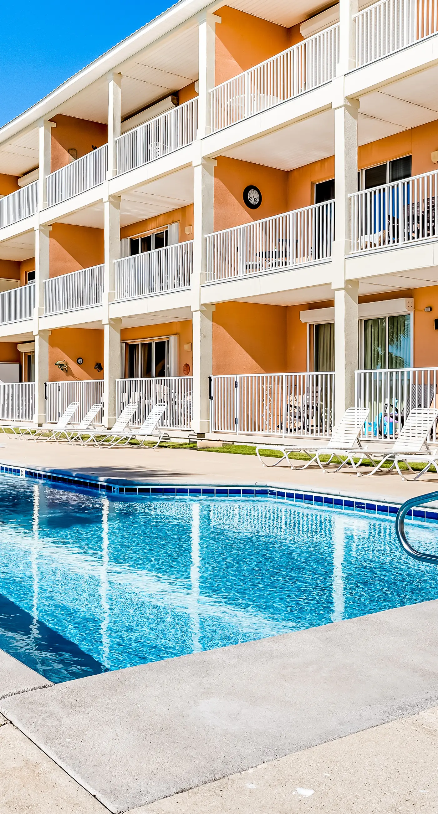 Ground-floor condo next to on-site pool with private patio & beach access