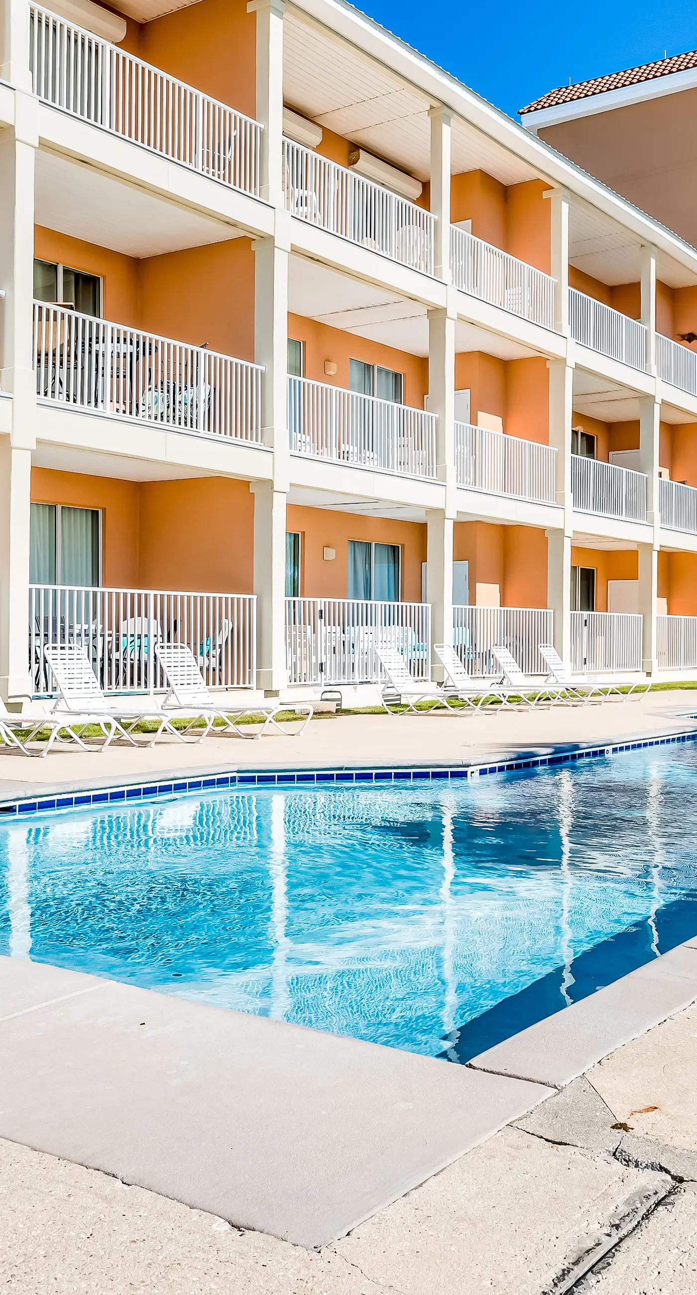 Ground-floor condo next to on-site pool with private patio & beach access