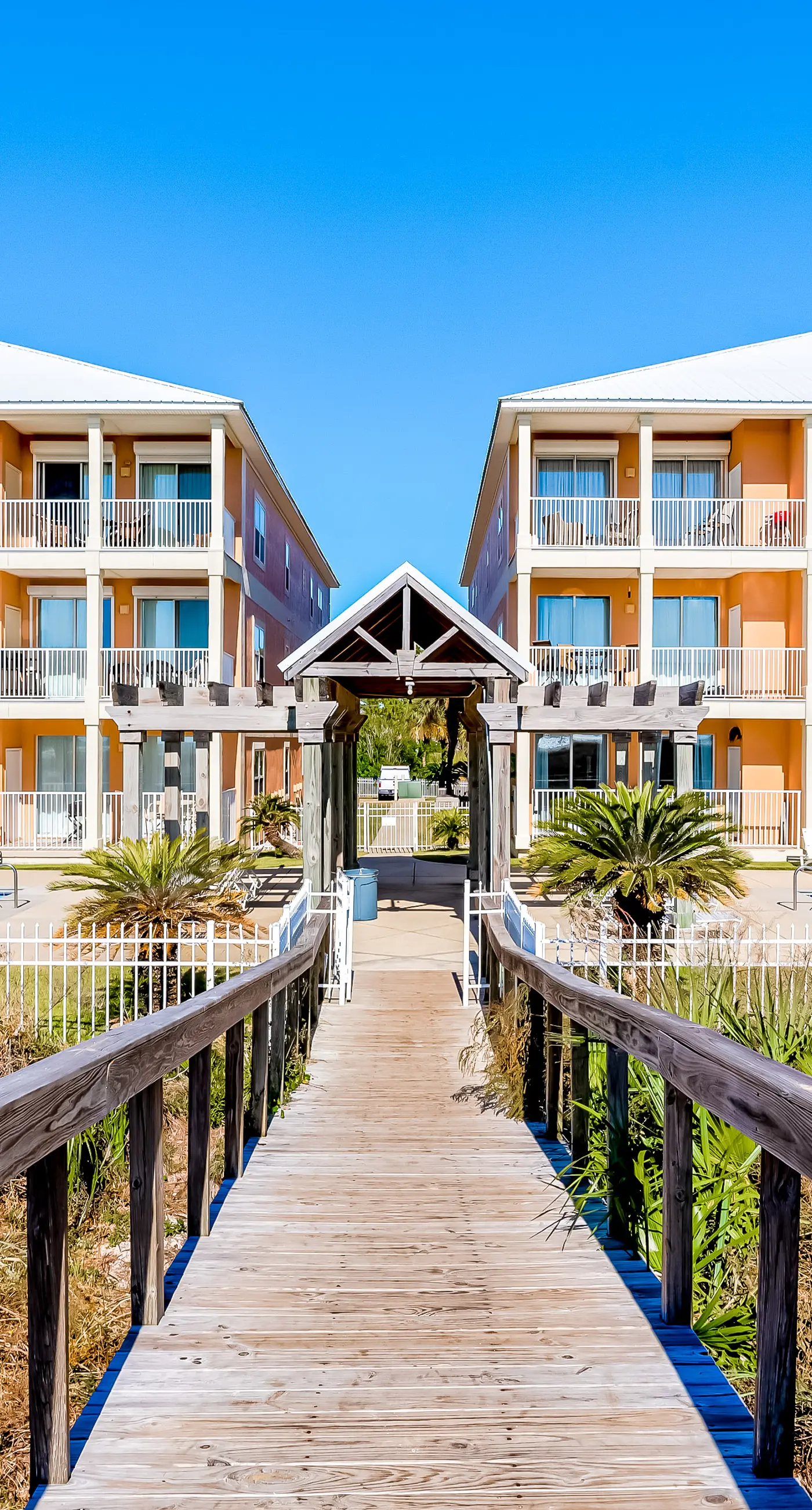 Ground-floor condo next to on-site pool with private patio & beach access