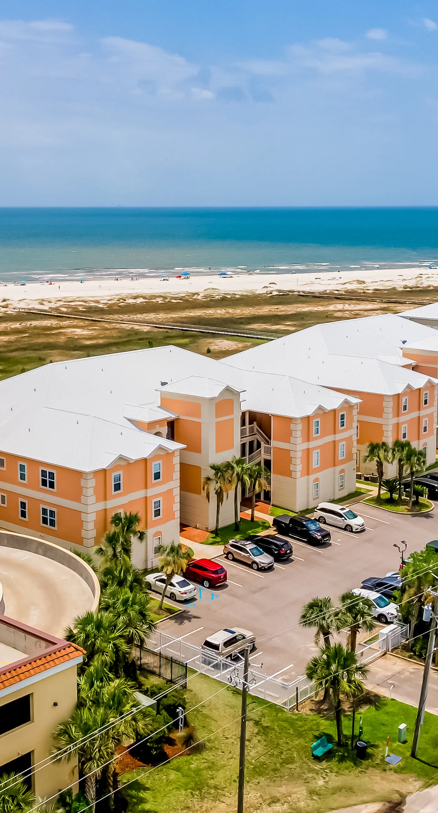 Ground-floor condo next to on-site pool with private patio & beach access