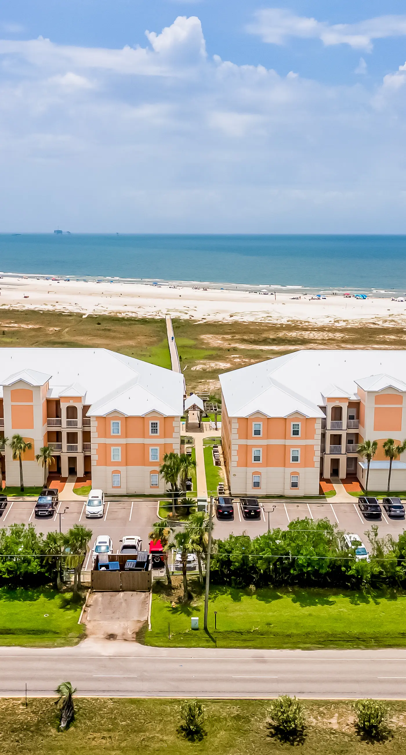 Ground-floor condo next to on-site pool with private patio & beach access