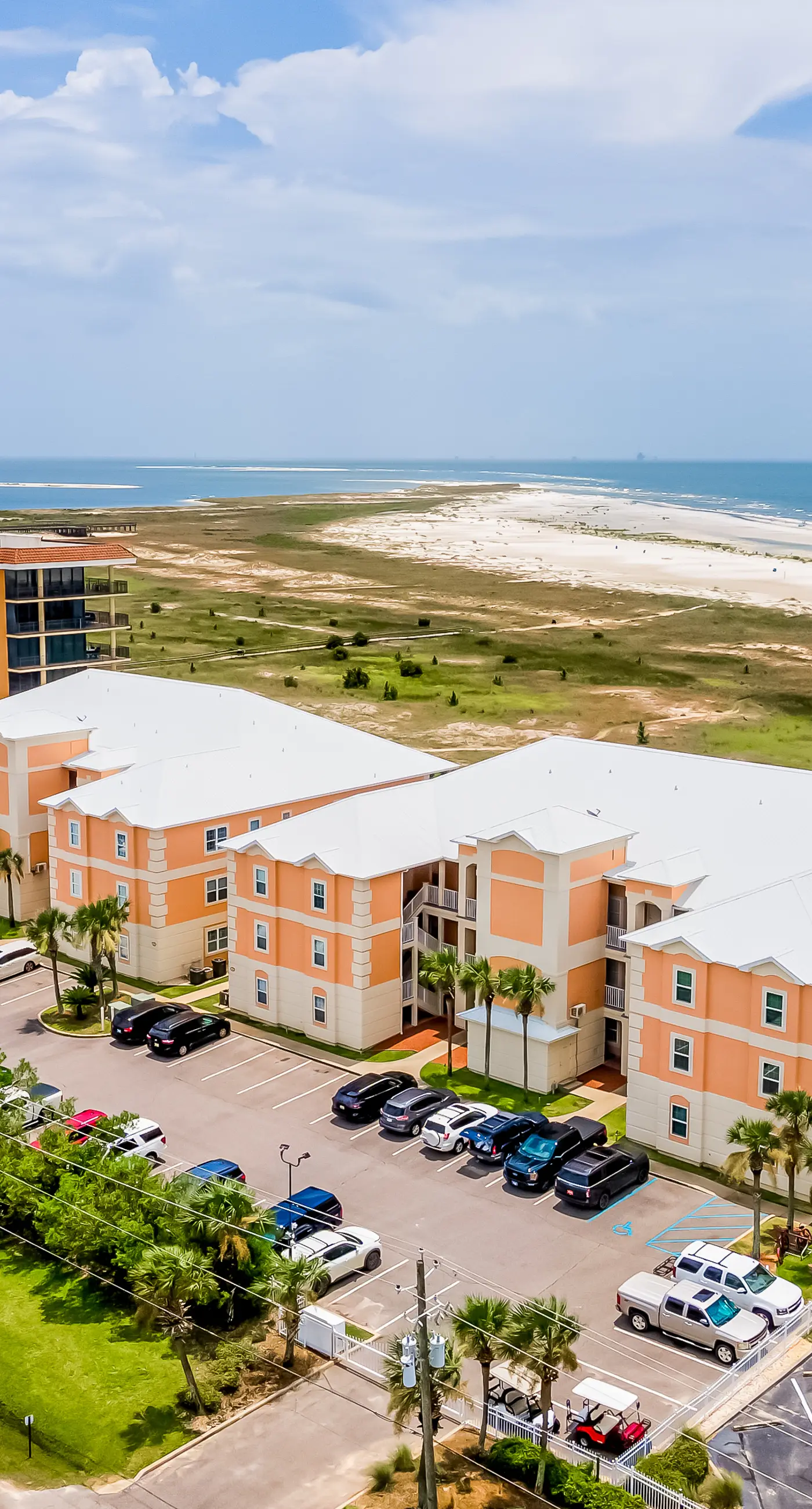 Ground-floor condo next to on-site pool with private patio & beach access