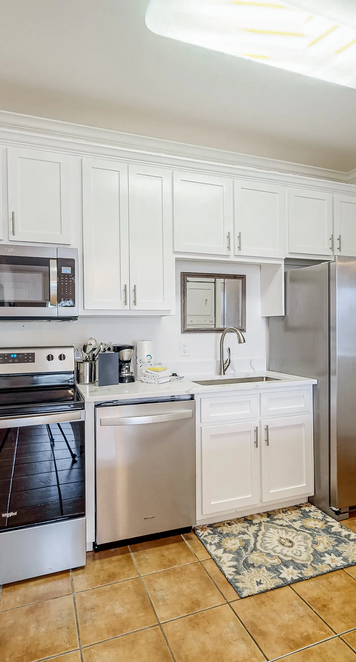 Newly -renovated waterfront condo w/two full kitchens, deck, WiFi, & shared pool