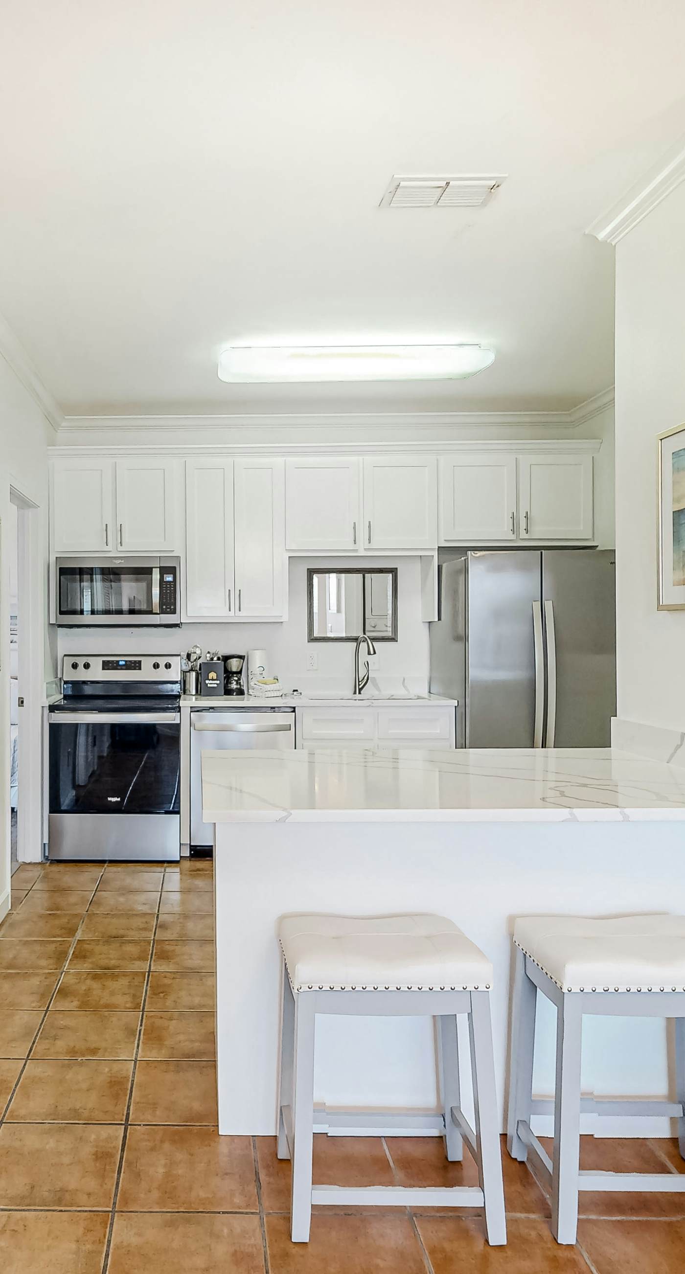 Newly renovated second-floor condo with shared pool, WiFi, W/D, & central AC