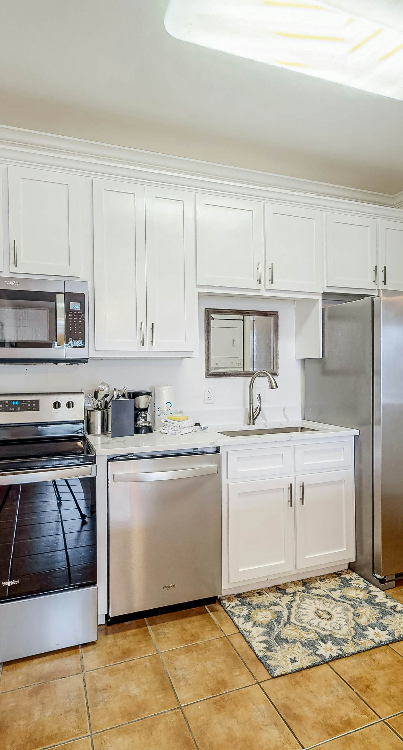 Newly renovated second-floor condo with shared pool, WiFi, W/D, & central AC