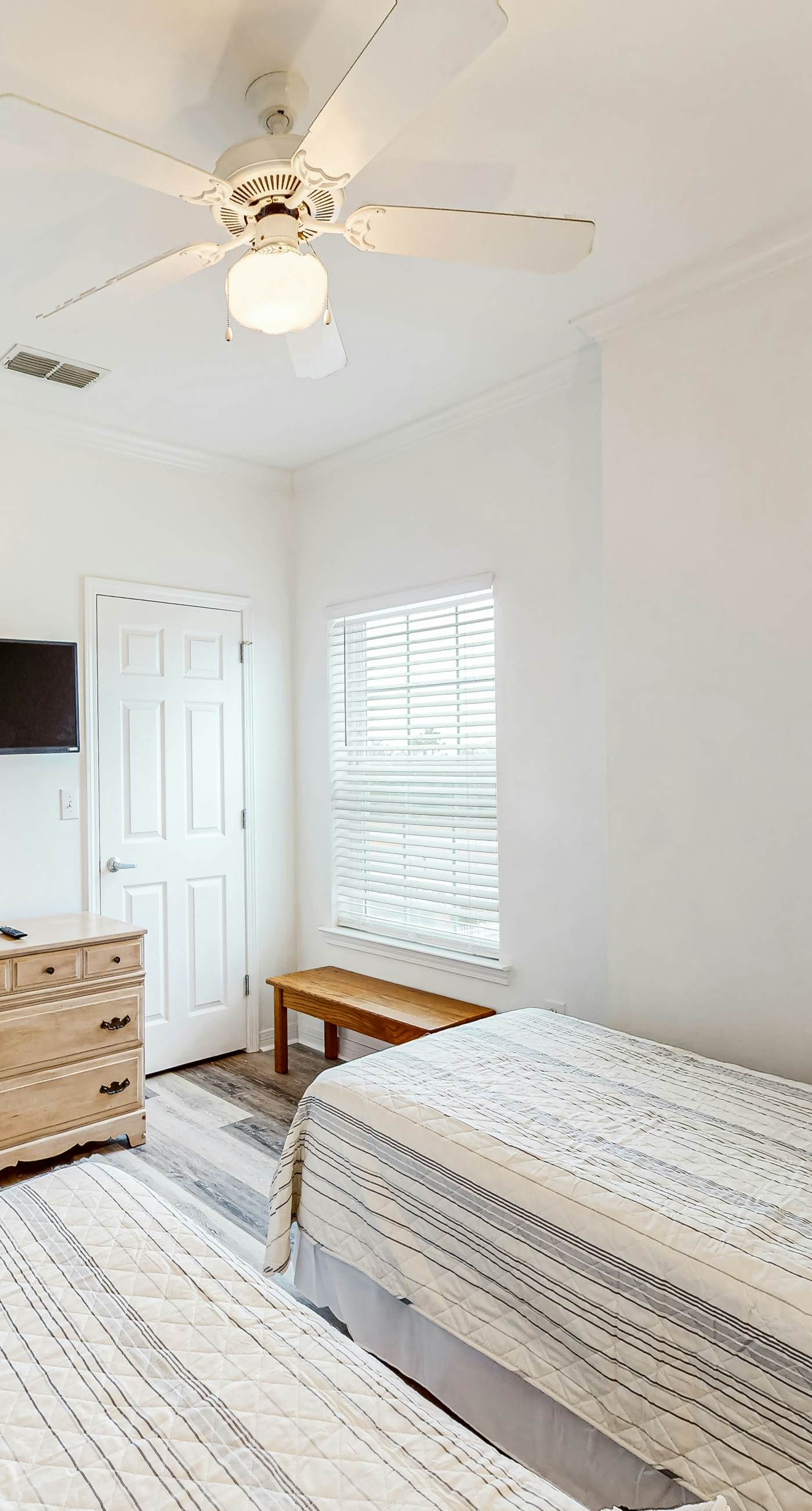 Newly renovated second-floor condo with shared pool, WiFi, W/D, & central AC