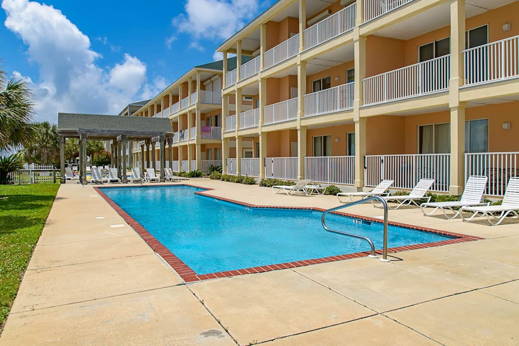 Newly renovated second-floor condo with shared pool, WiFi, W/D, & central AC