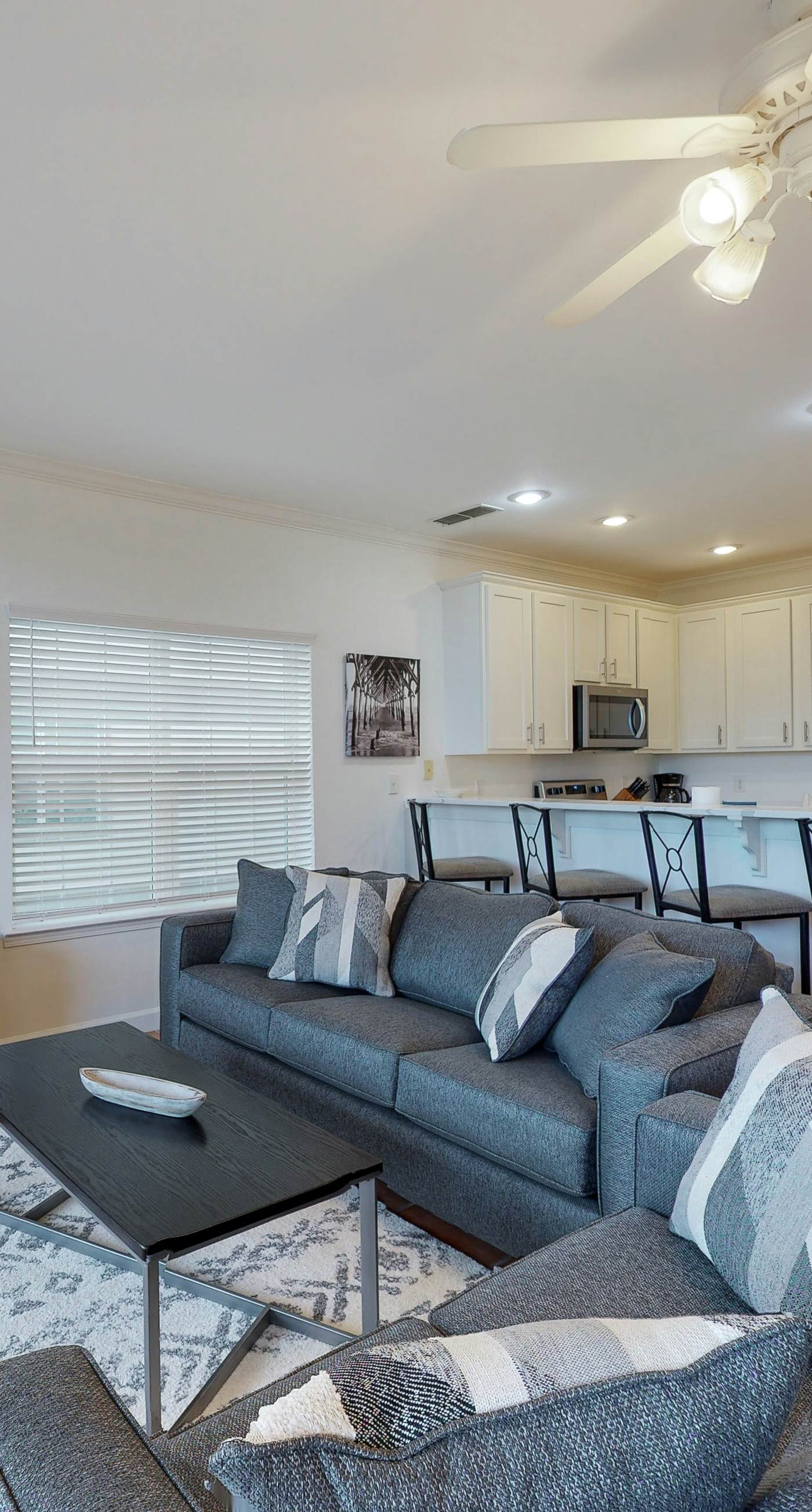 Newly renovated waterfront condo with pool, WiFi, W/D, & central AC