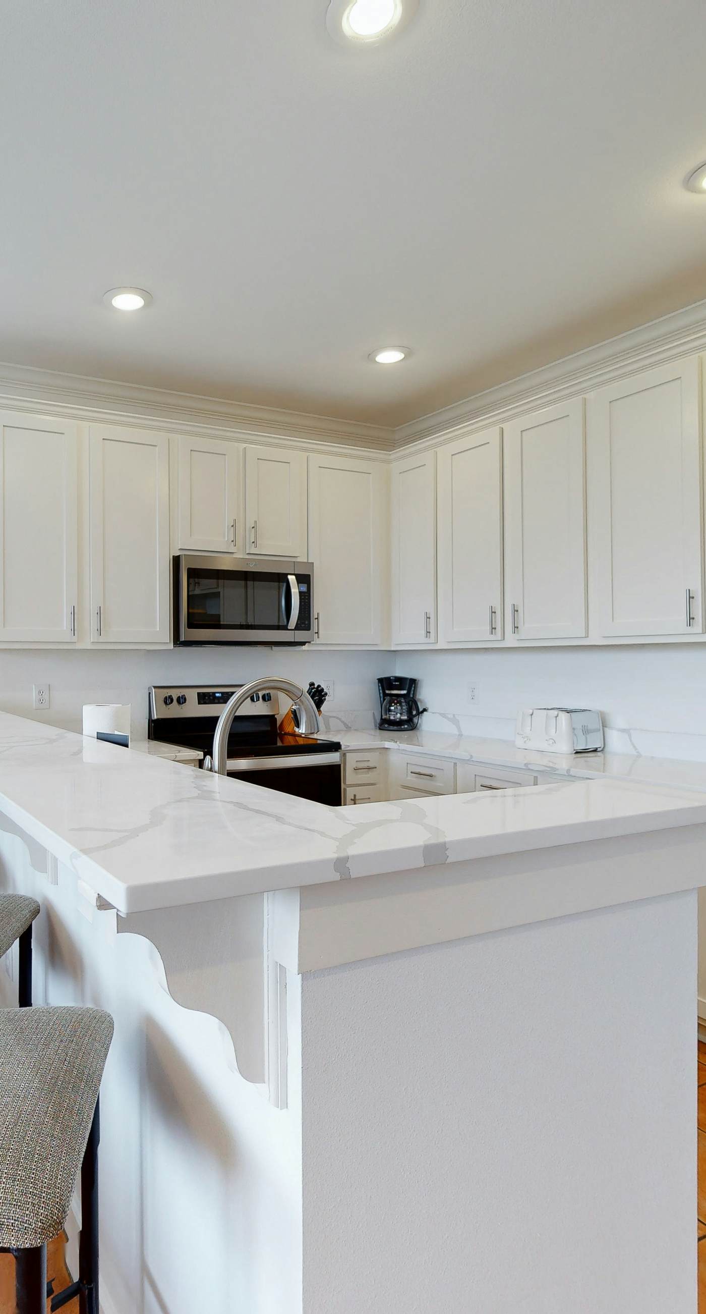 Newly renovated waterfront condo with pool, WiFi, W/D, & central AC