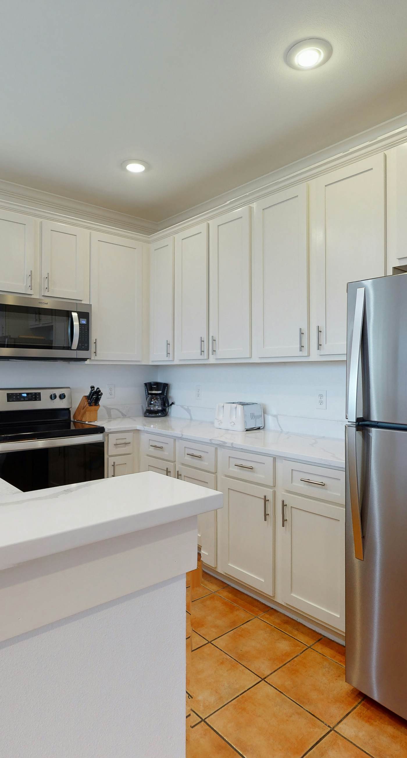 Newly renovated waterfront condo with pool, WiFi, W/D, & central AC