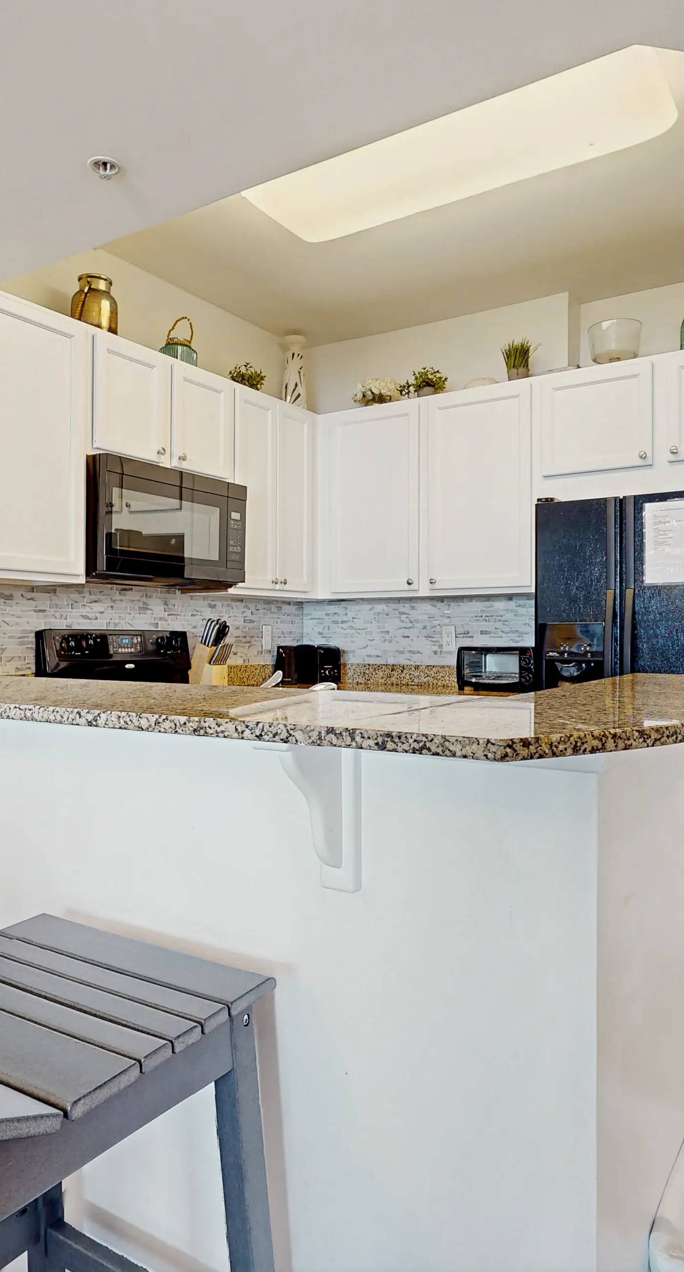 Sunlit Condo with Shared Pools, Partial Ocean Views, Fast WiFi, & Private W/D