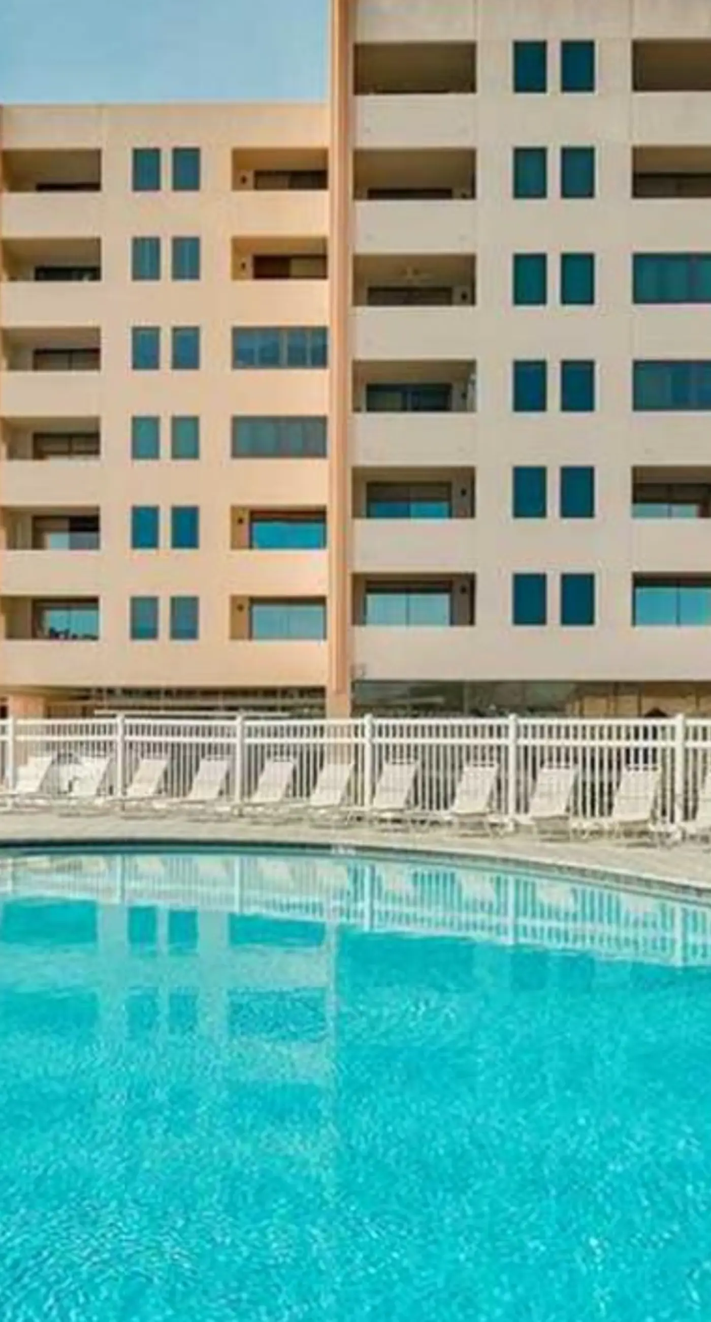 Fourth Floor Oceanfront Condo with Shared Pool, Ocean View, WiFi, W/D, and AC