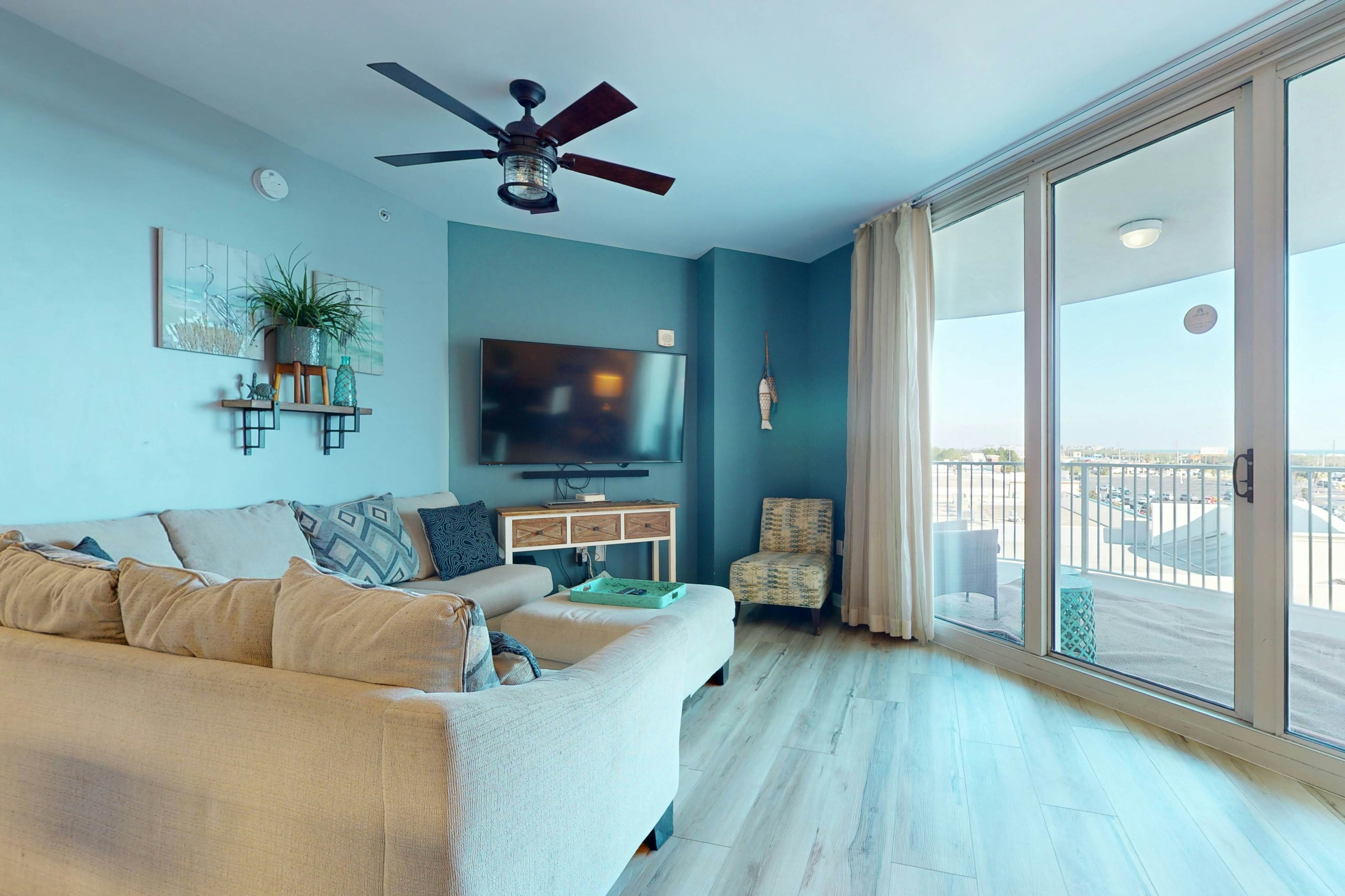 Beachy condo with furnished balconies, WiFi, AC, w/d, shared pool, and hot tub