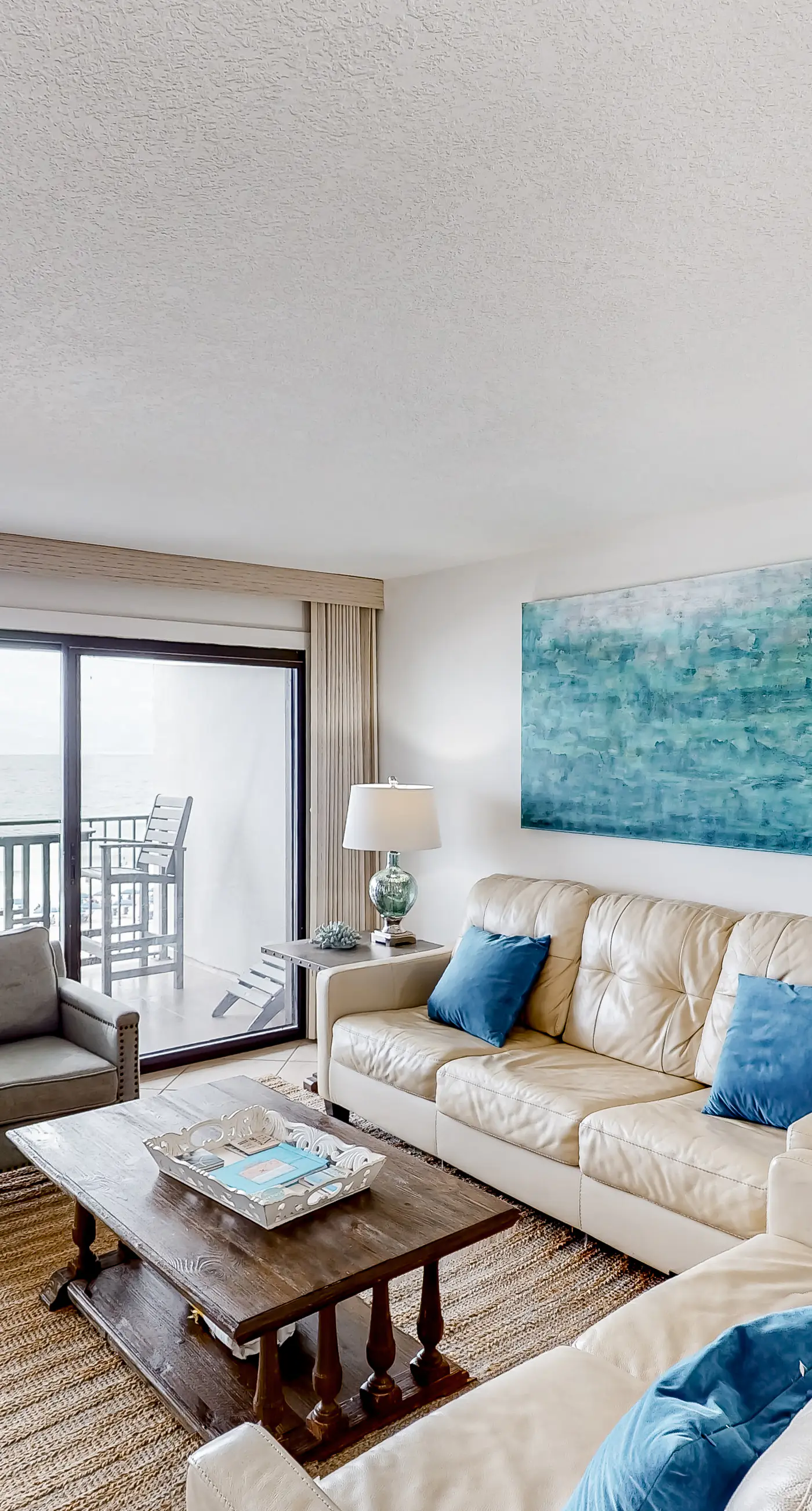 Waterfront escape with gulf views, pool, beach access, gym, balcony & AC