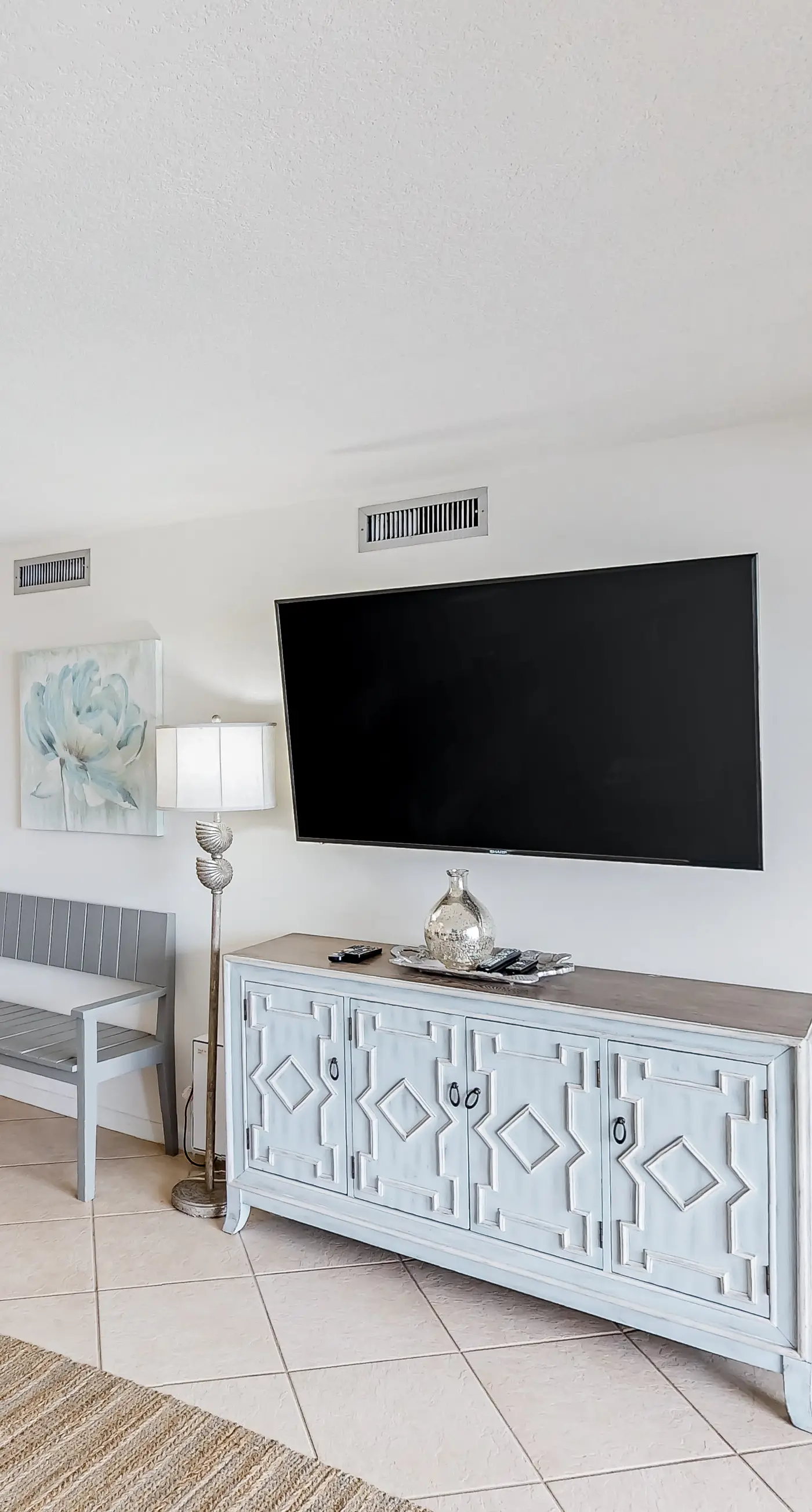 Waterfront escape with gulf views, pool, beach access, gym, balcony & AC