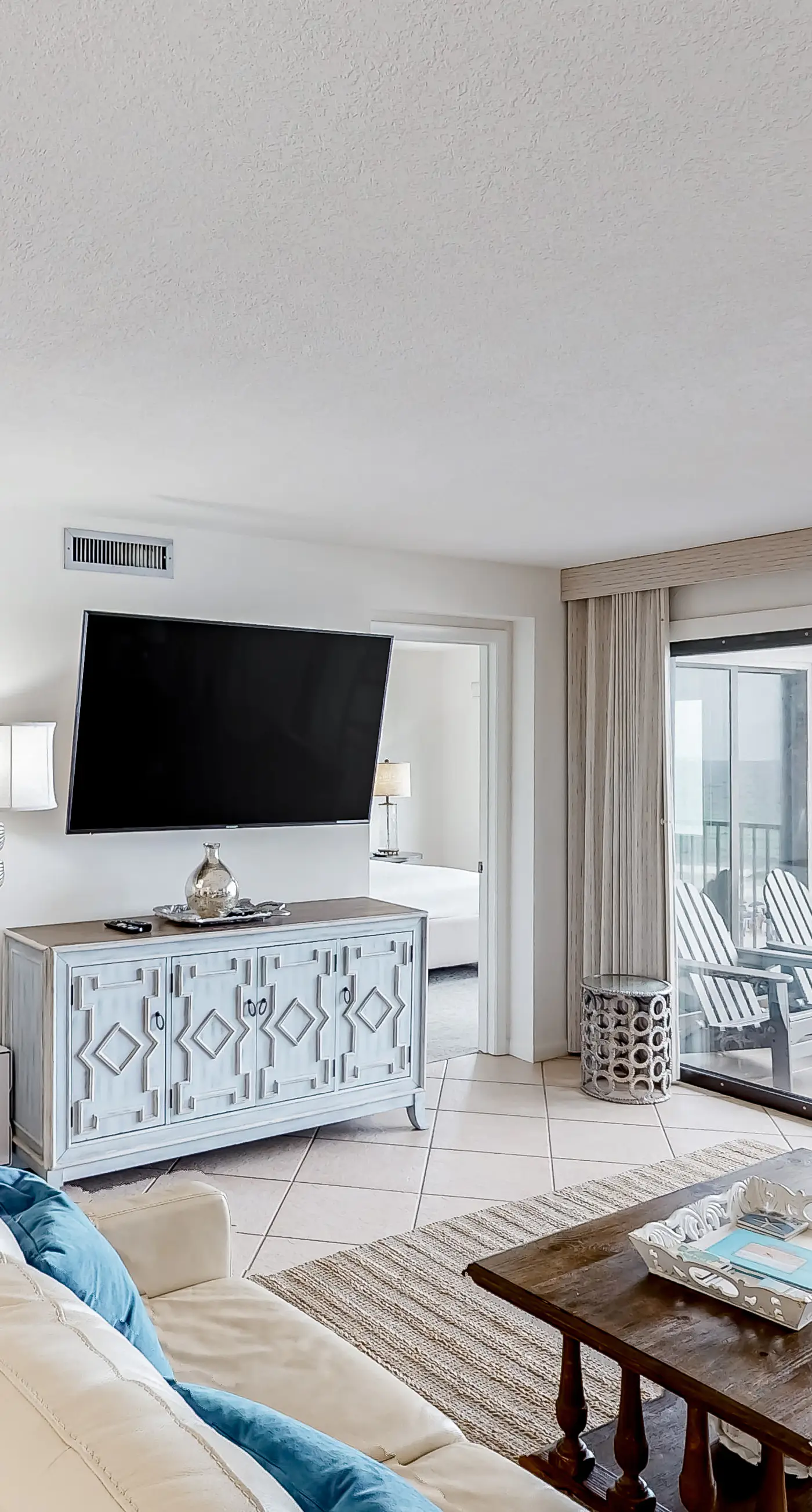 Waterfront escape with gulf views, pool, beach access, gym, balcony & AC