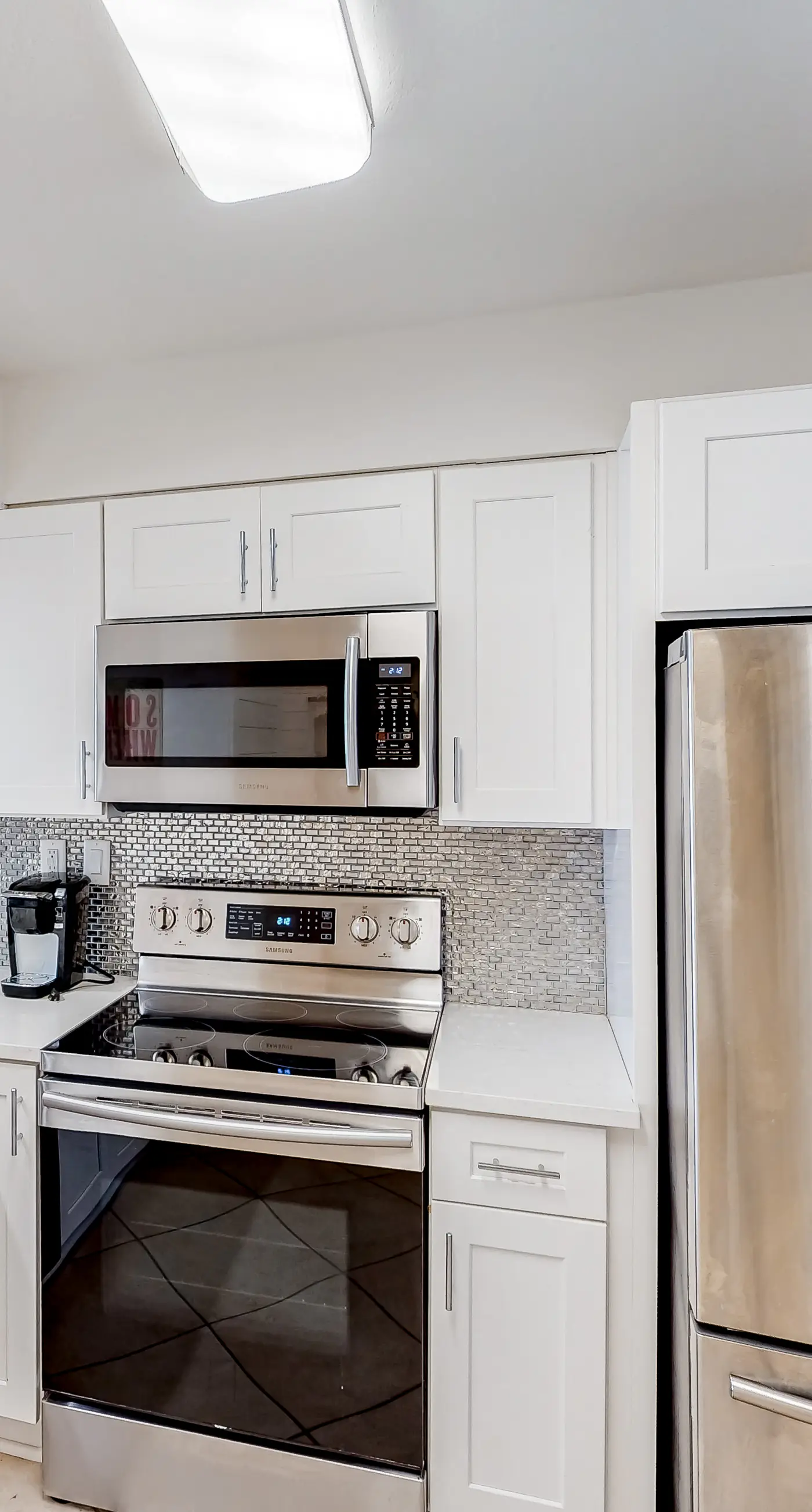 Waterfront escape with gulf views, pool, beach access, gym, balcony & AC