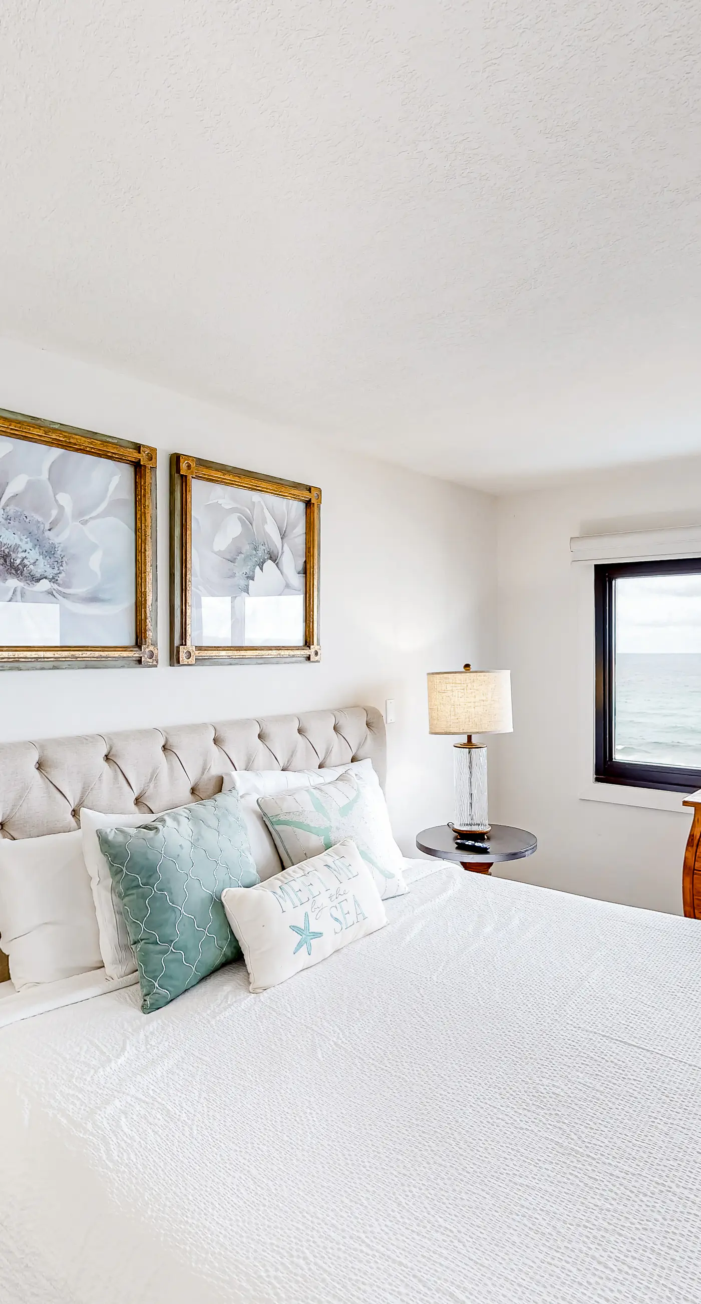 Waterfront escape with gulf views, pool, beach access, gym, balcony & AC