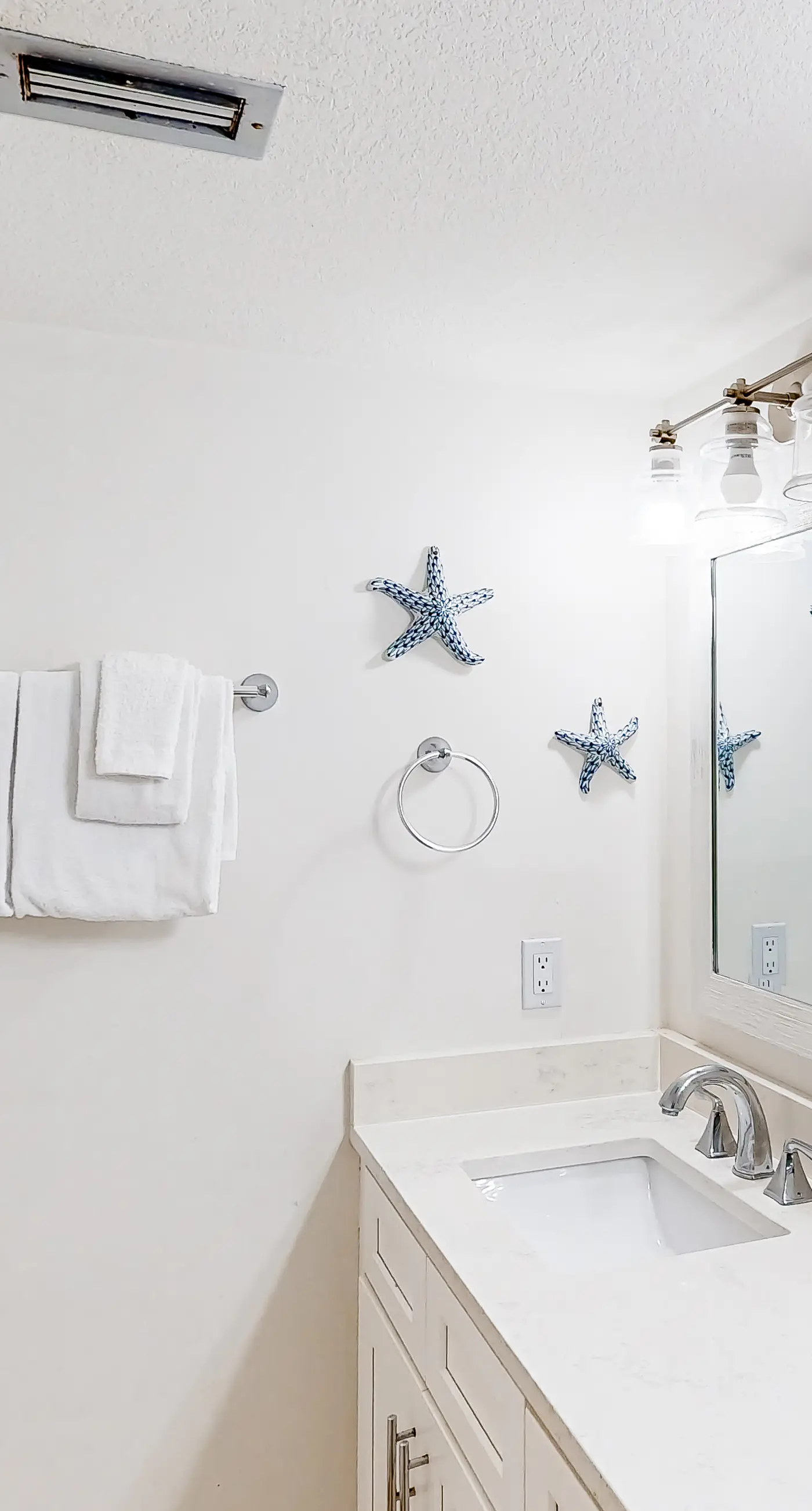 Waterfront escape with gulf views, pool, beach access, gym, balcony & AC