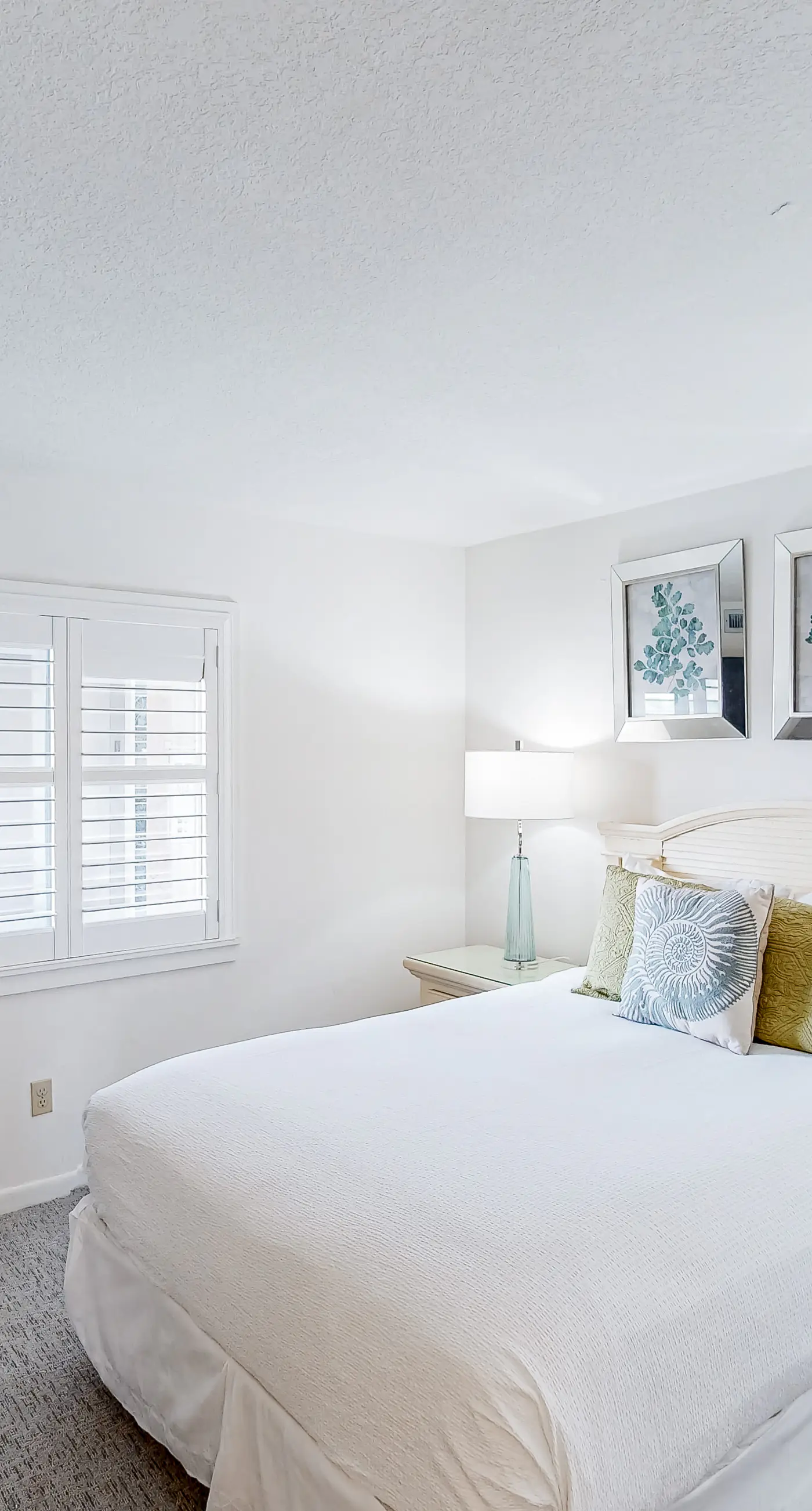 Waterfront escape with gulf views, pool, beach access, gym, balcony & AC