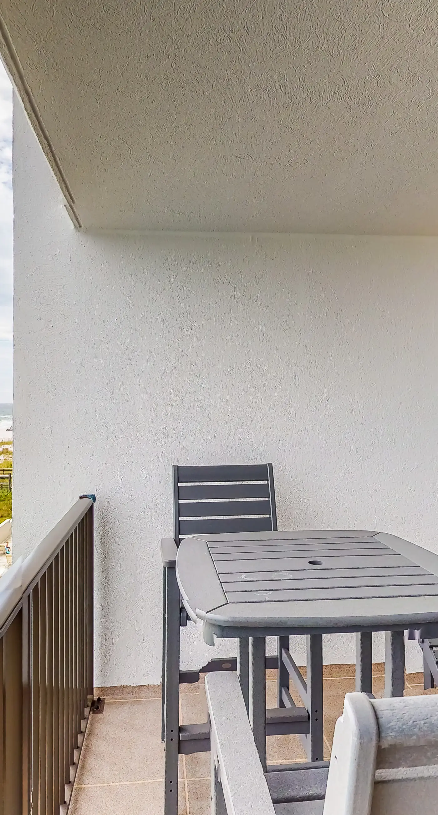 Waterfront escape with gulf views, pool, beach access, gym, balcony & AC