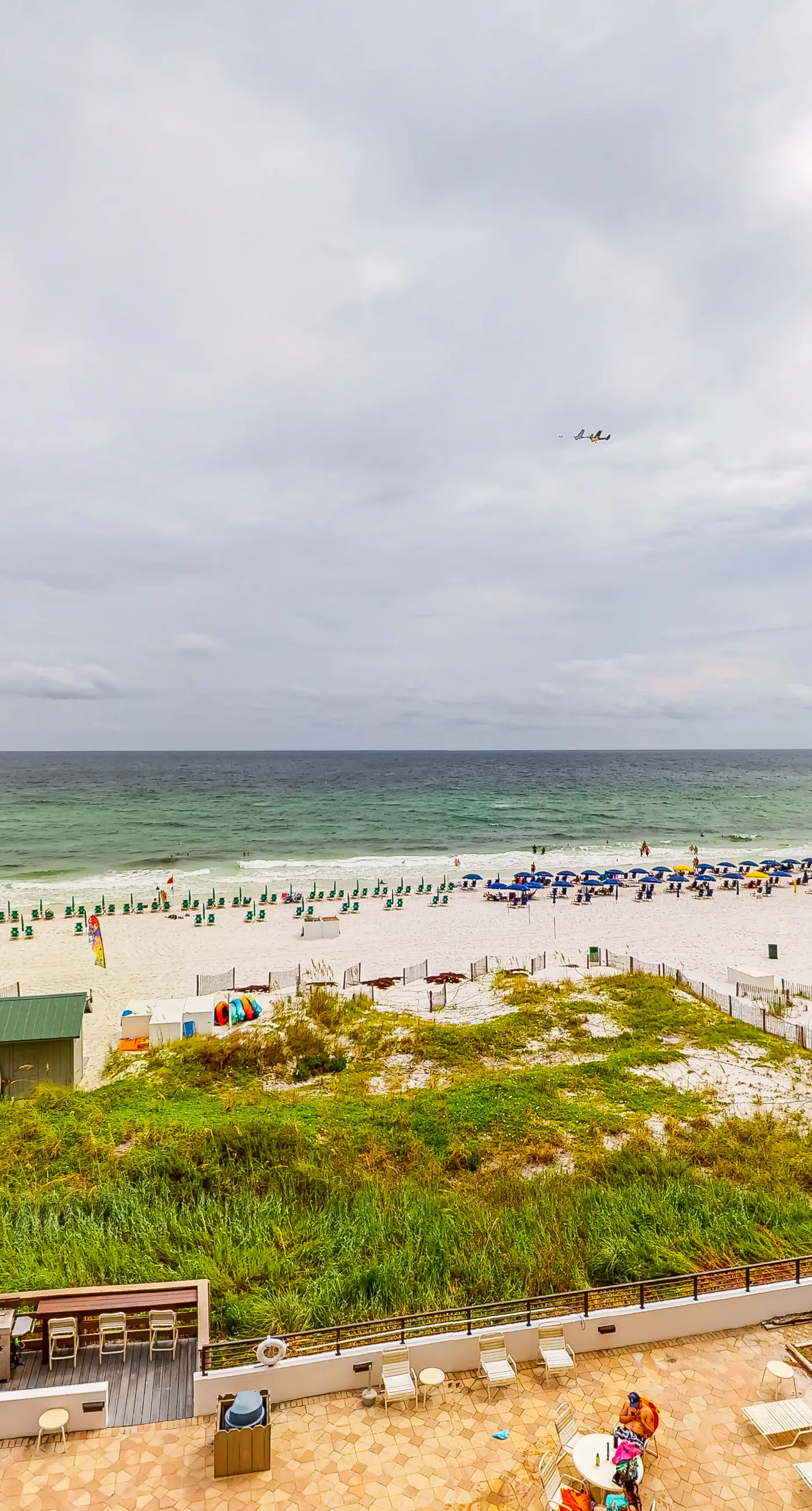 Waterfront escape with gulf views, pool, beach access, gym, balcony & AC