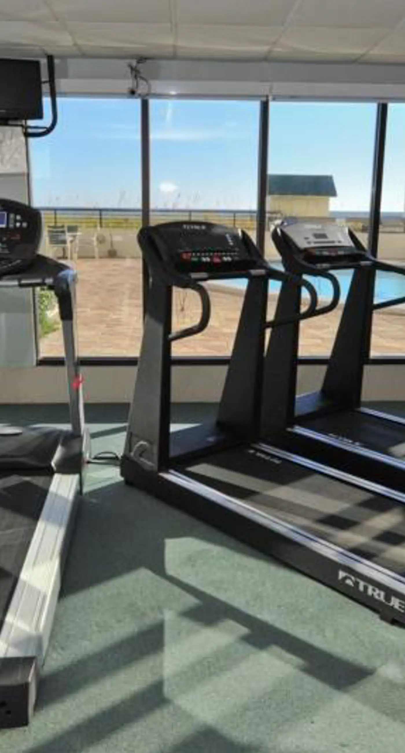 Waterfront escape with gulf views, pool, beach access, gym, balcony & AC