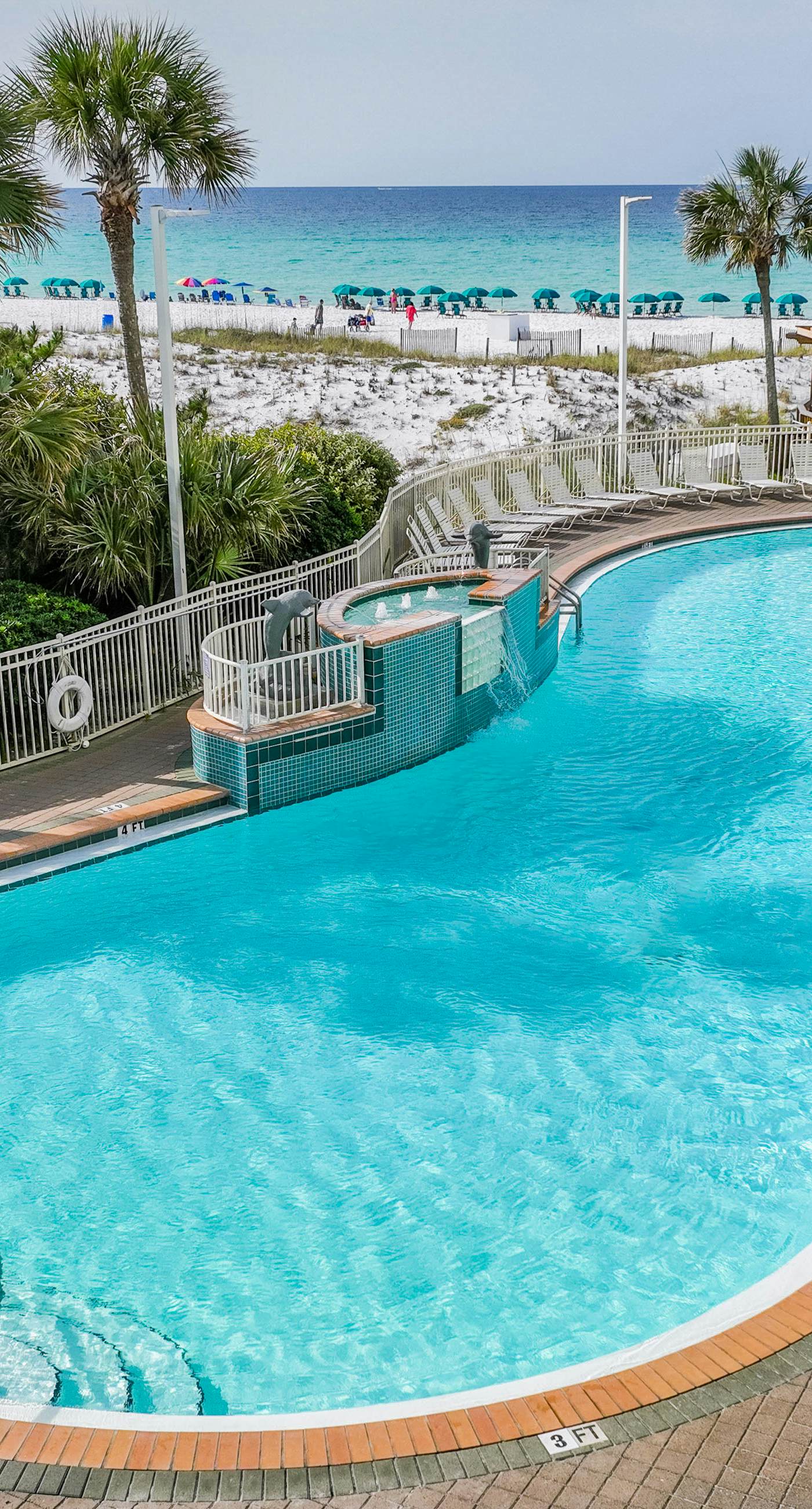 Gulf-front condo with balcony, water views, pools, hot tub & beach access