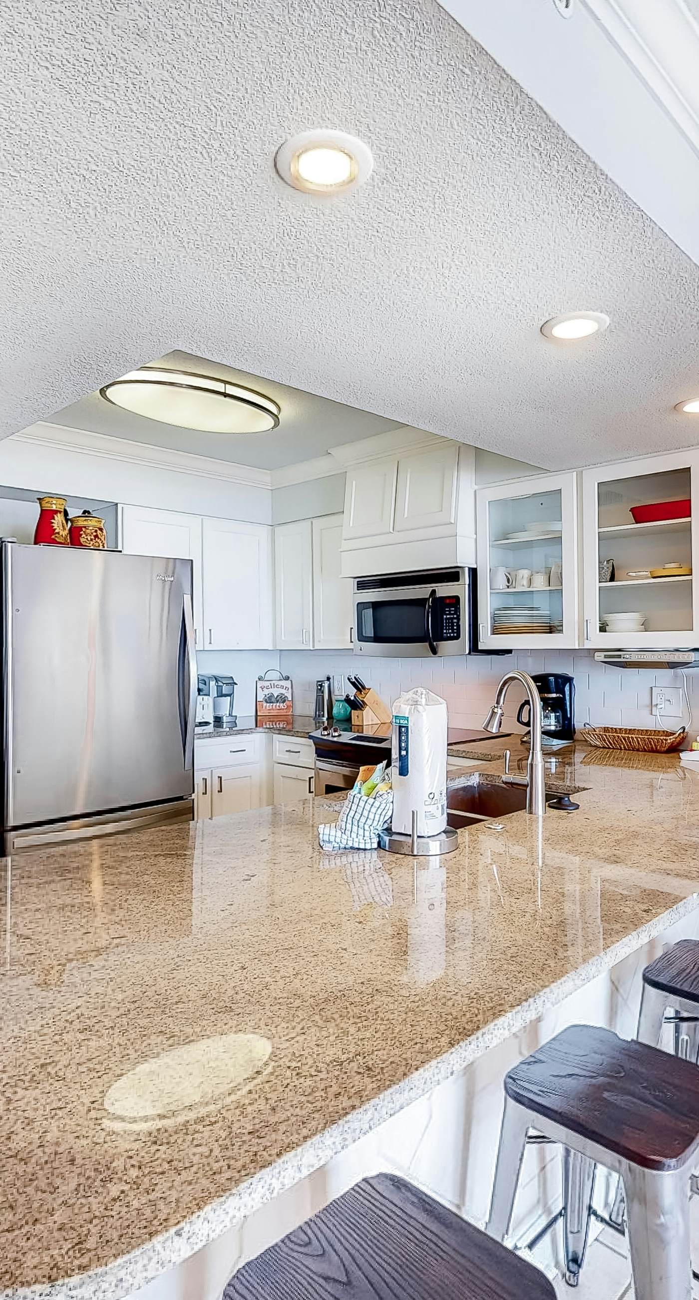 Gulf-front condo with balcony, water views, pools, hot tub & beach access