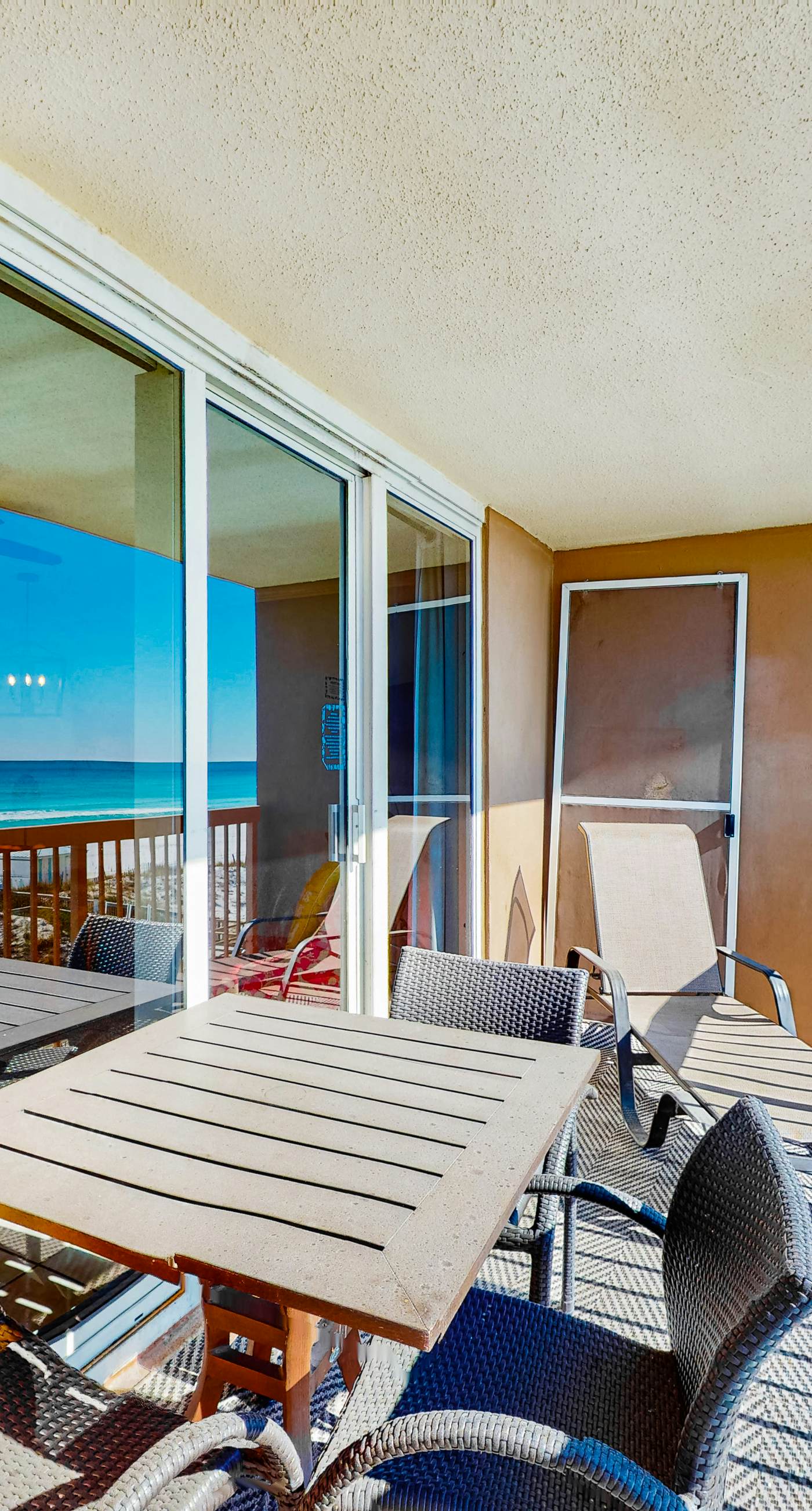 Gulf-front condo with balcony, water views, pools, hot tub & beach access
