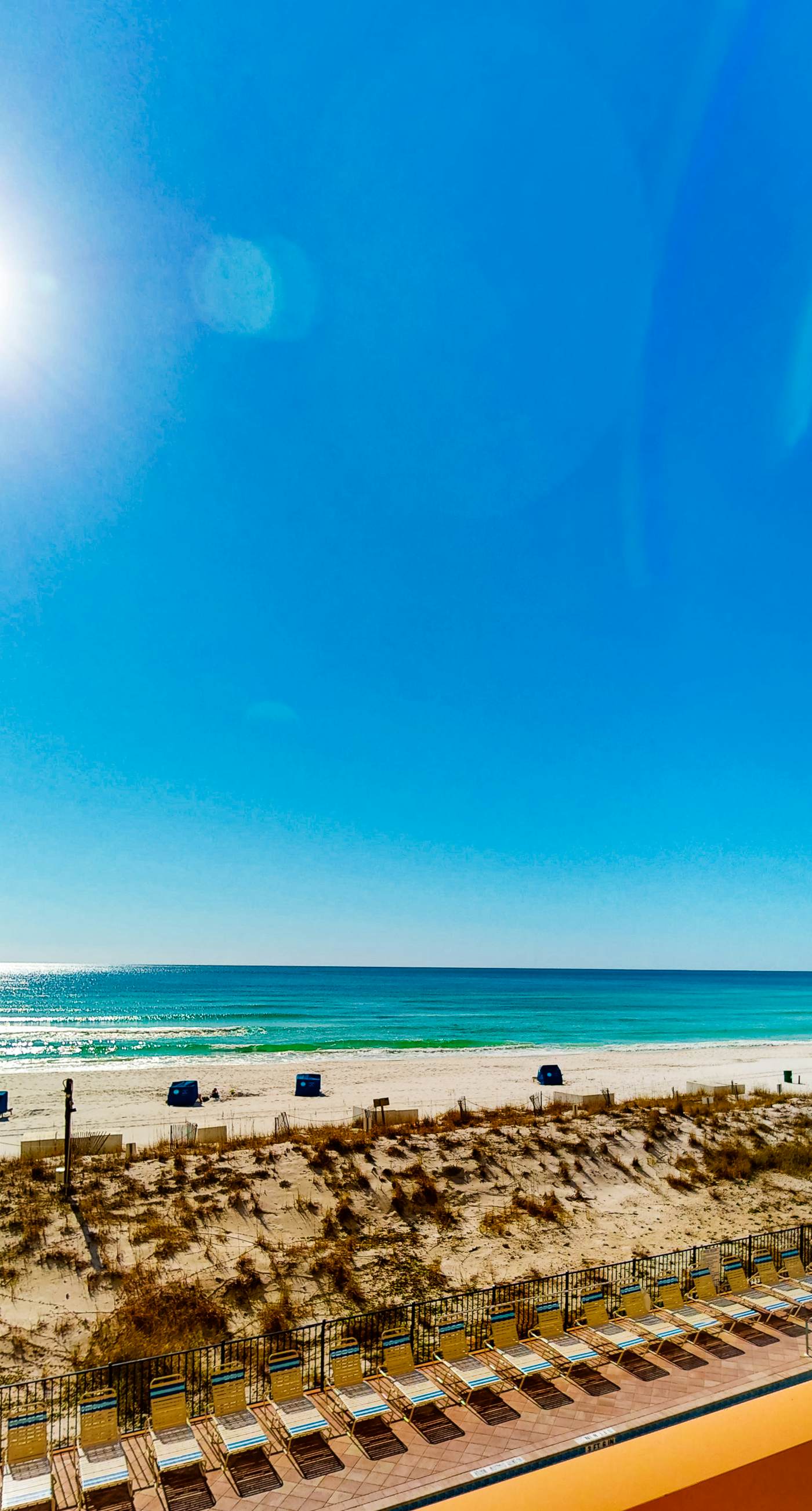 Gulf-front condo with balcony, water views, pools, hot tub & beach access