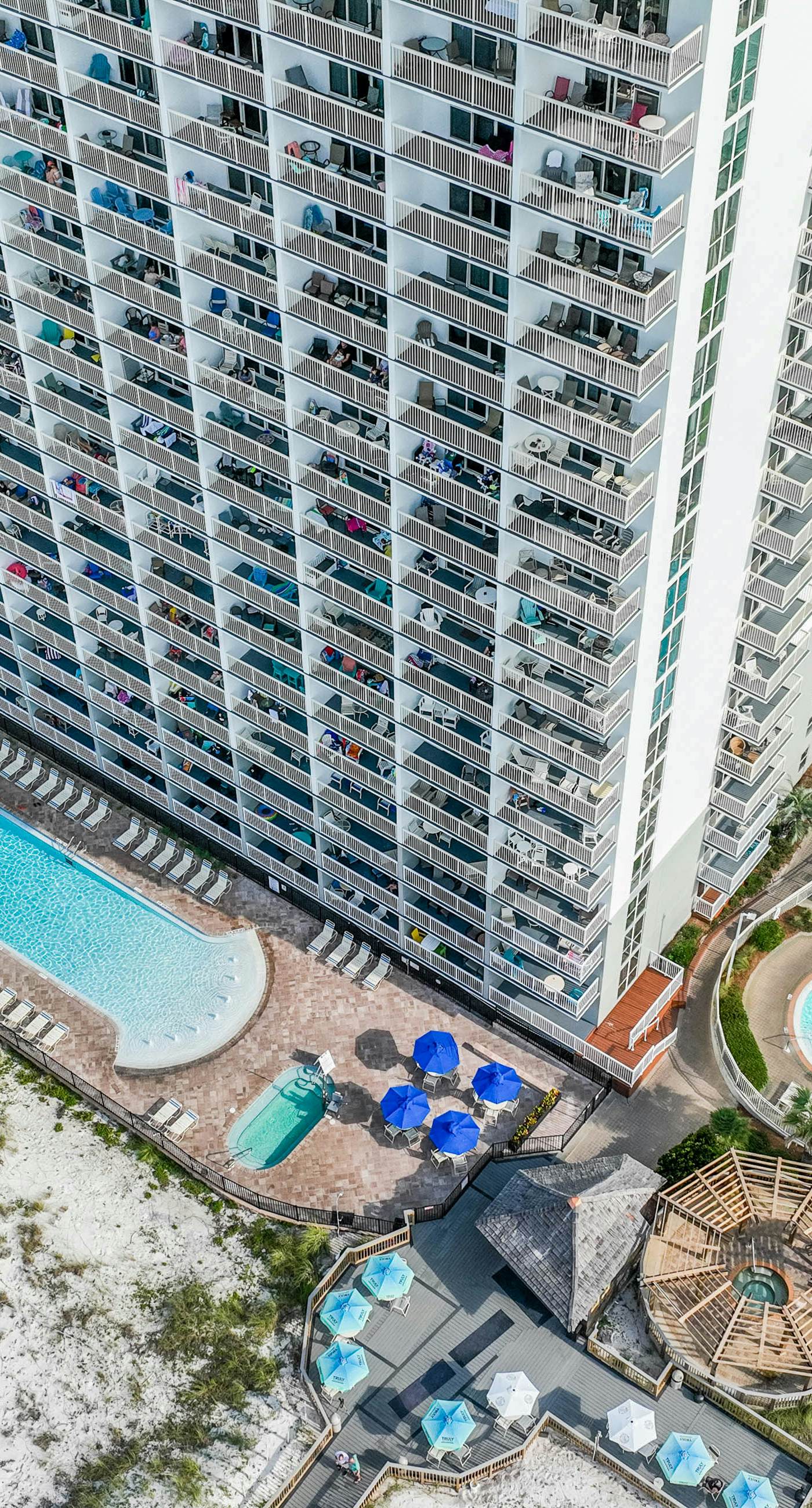 Gulf-front condo with balcony, water views, pools, hot tub & beach access