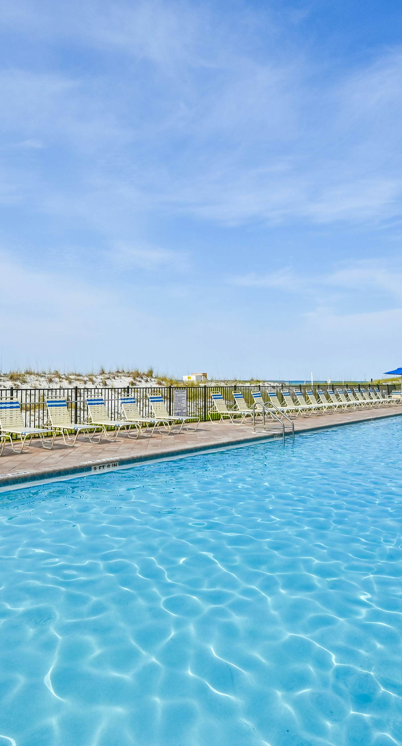 Gulf-front condo with balcony, water views, pools, hot tub & beach access