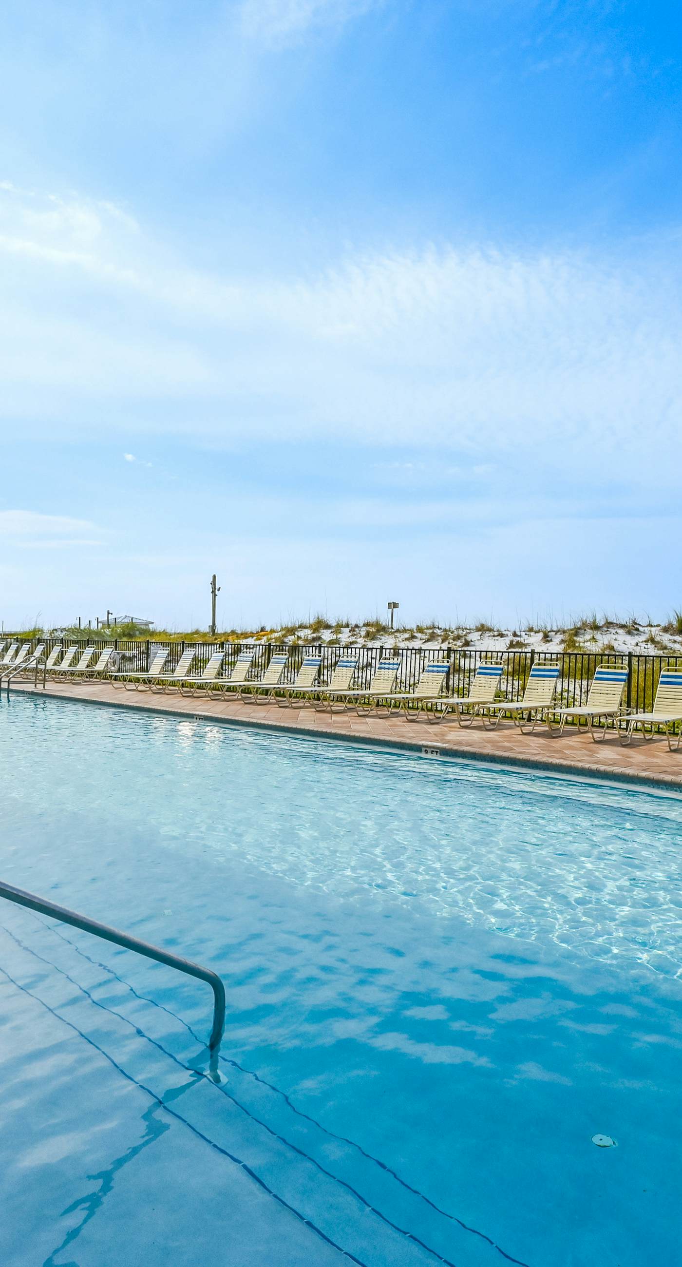 Gulf-front condo with balcony, water views, pools, hot tub & beach access