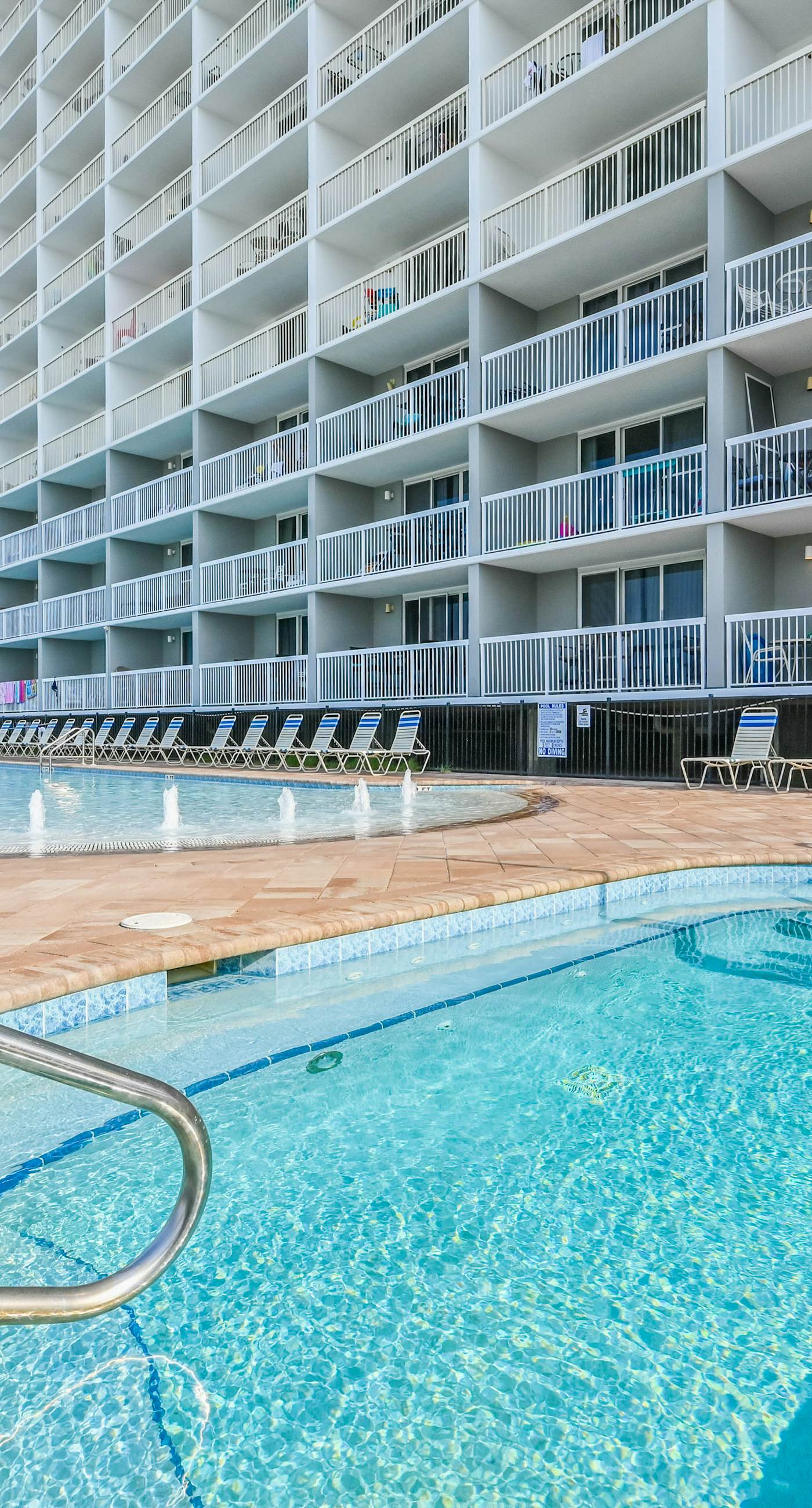 Gulf-front condo with balcony, water views, pools, hot tub & beach access