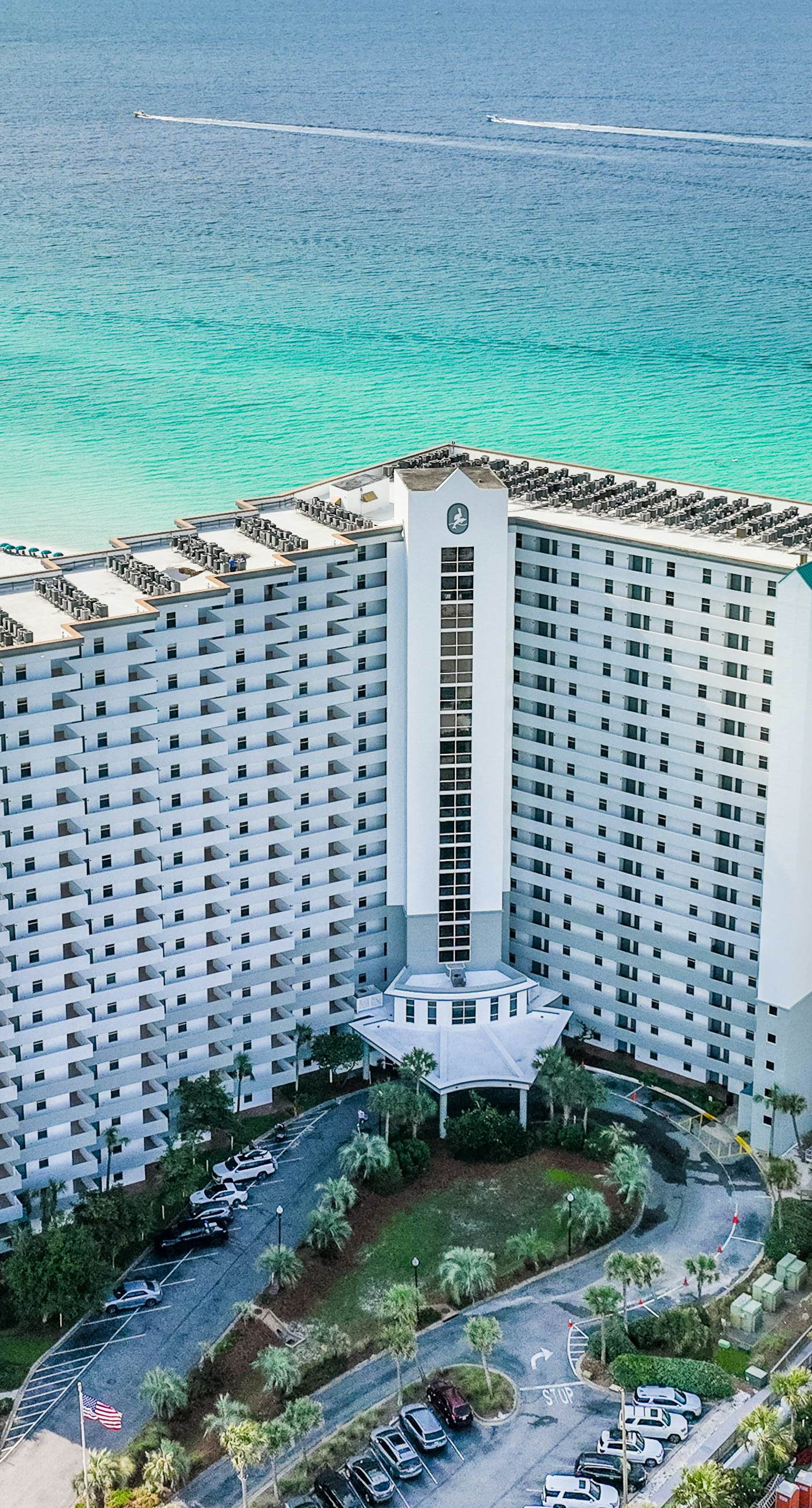 Gulf-front condo with balcony, water views, pools, hot tub & beach access