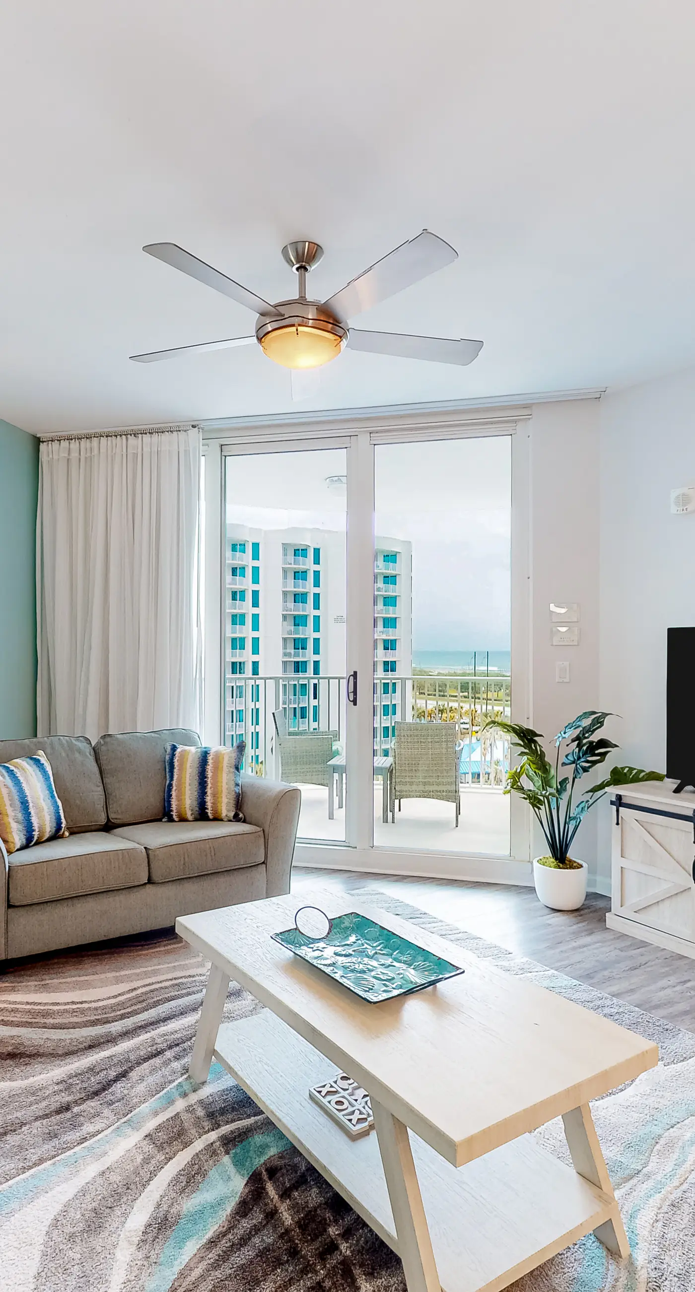 Beachy resort condo with balcony, outdoor pools, hot tub, gym, tennis, AC, & W/D