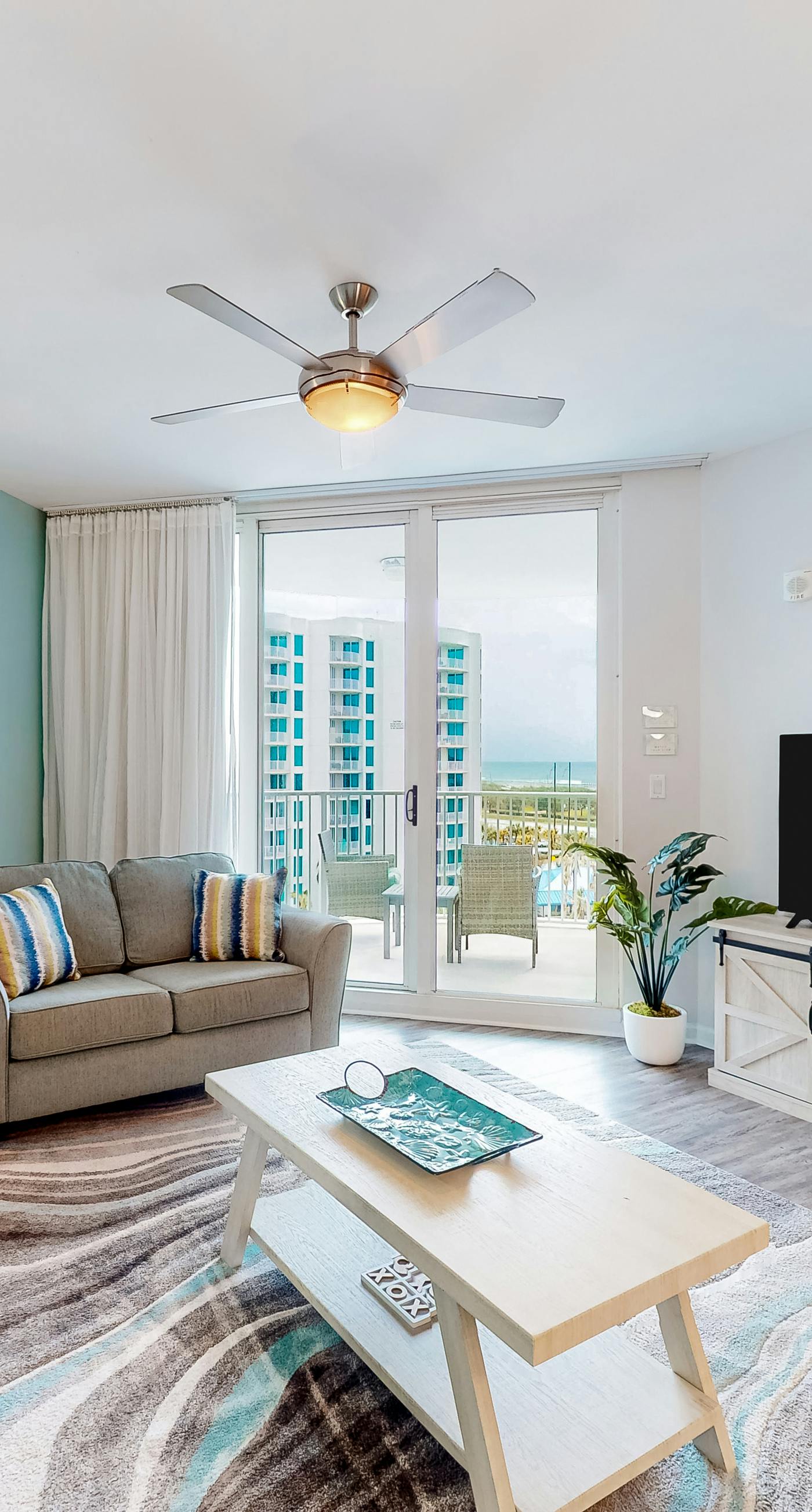 Beachy resort condo with balcony, outdoor pools, hot tub, gym, tennis, AC, & W/D