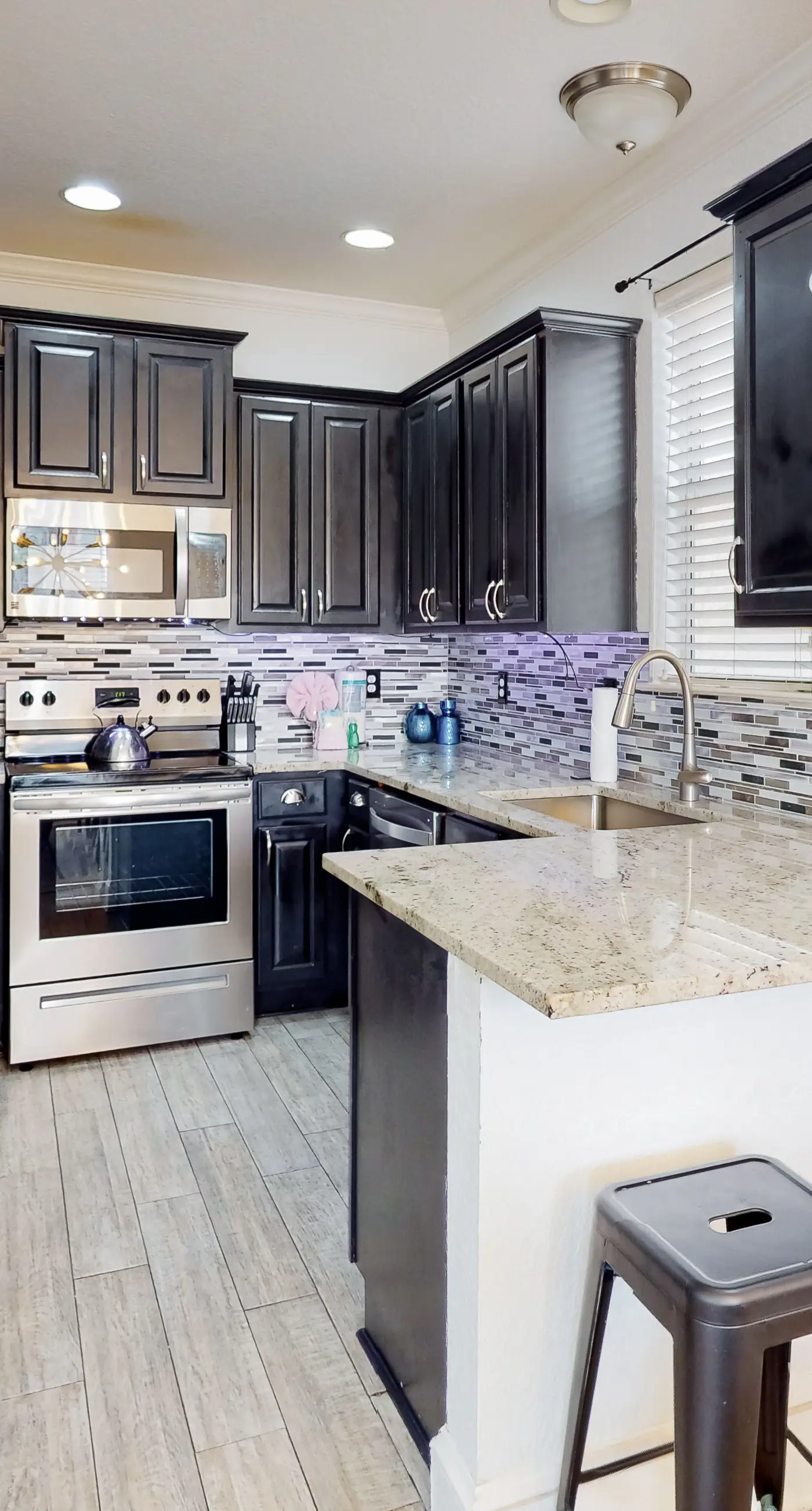 Dog-friendly home near beach with pool access, two balconies, wet bar, & W/D