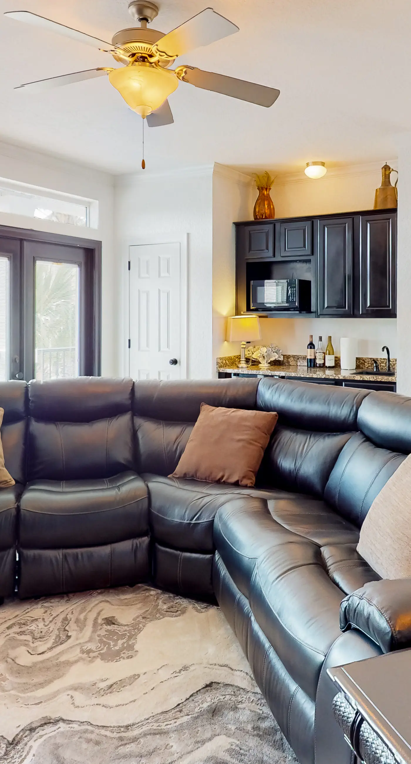 Dog-friendly home near beach with pool access, two balconies, wet bar, & W/D