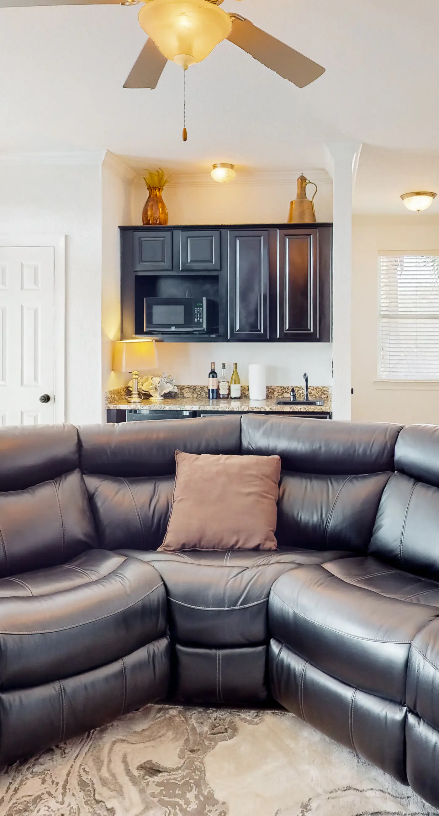 Dog-friendly home near beach with pool access, two balconies, wet bar, & W/D